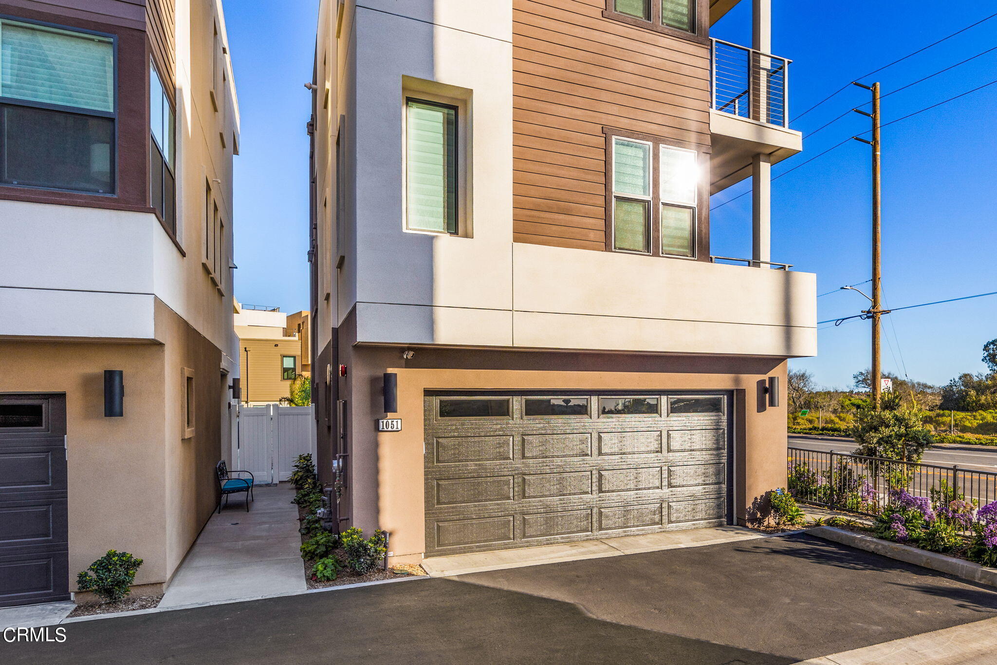 1051 Canal Street Oxnard, CA 93035 - Photo 5 of 54 a front view of a house with a garage