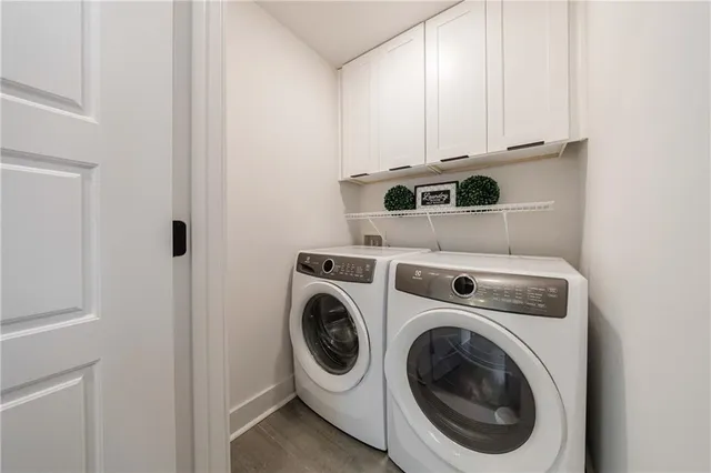 a bathroom with a sink and a washer dryer