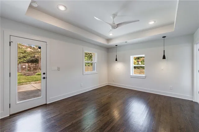 a bedroom with a large bed and a potted plant