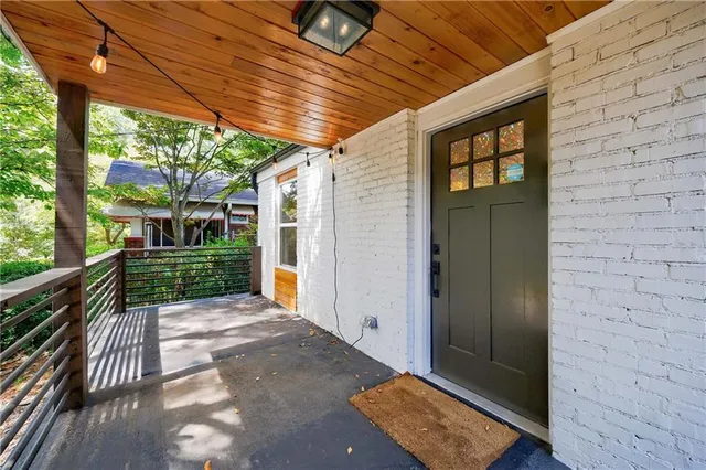 a living room with furniture a fireplace and a window
