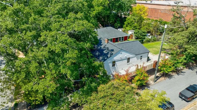an aerial view of a house with a garden and a yard