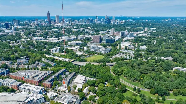 an aerial view of residential houses with city view