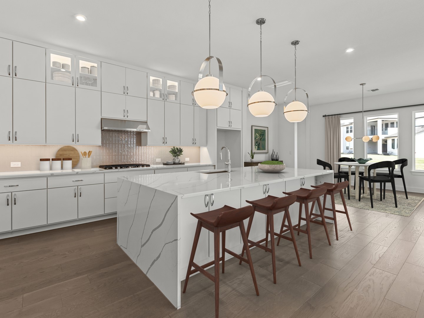 2508 Chiavari Way Leander, TX 78641 - Photo 8 of 24 Culinary excellence awaits in this modern kitchen, featuring a spacious island with bar seating and integrated appliances.