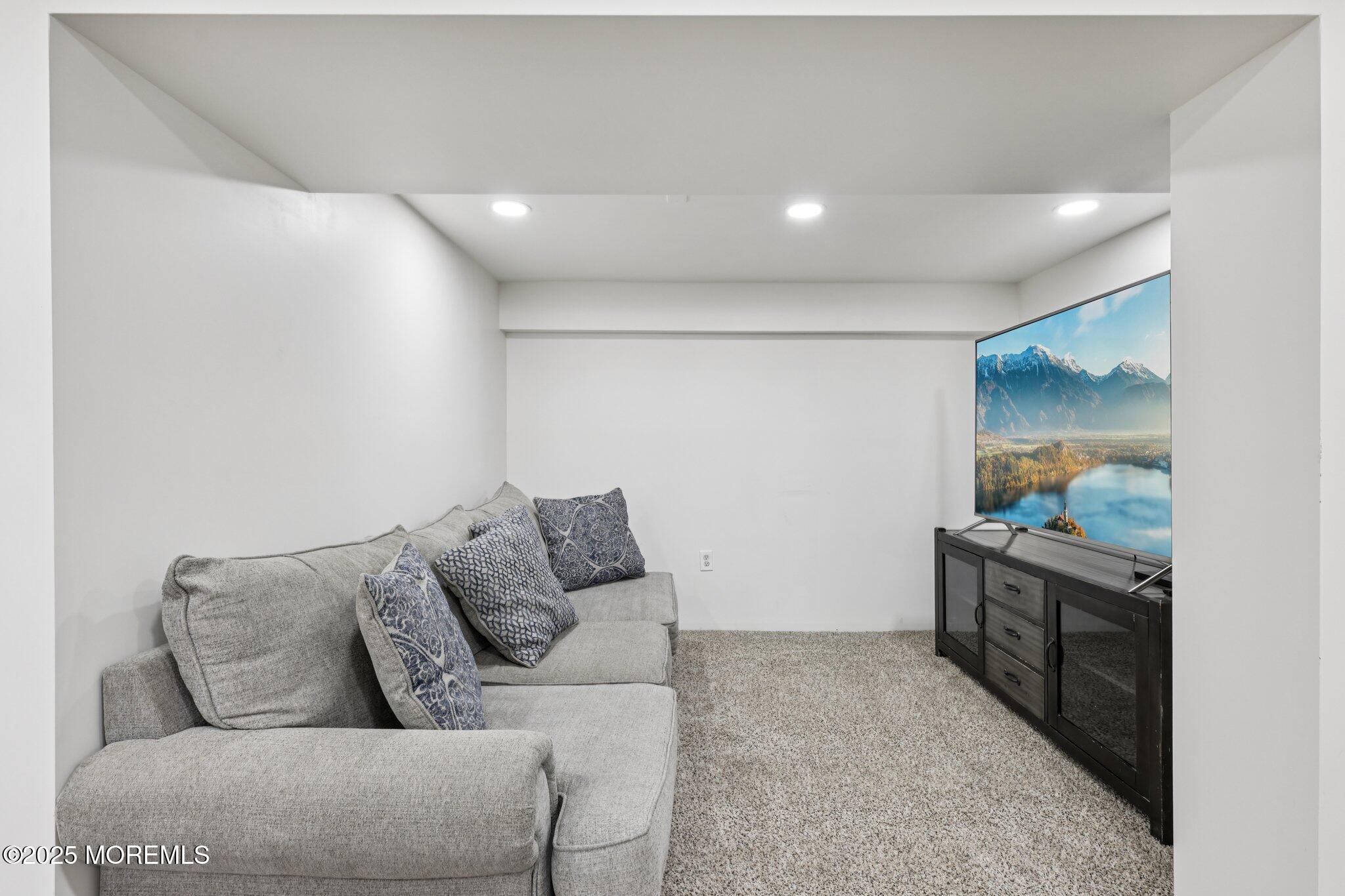 3 Duke Lane Hazlet, NJ 07730 - Photo 17 of 50 a living room with furniture and a flat screen tv