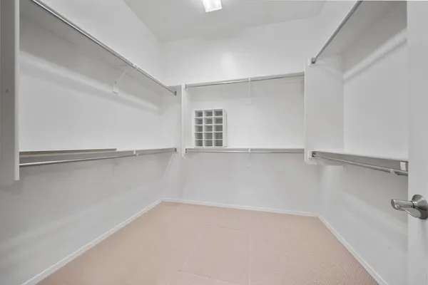 a view of an empty walk in closet
