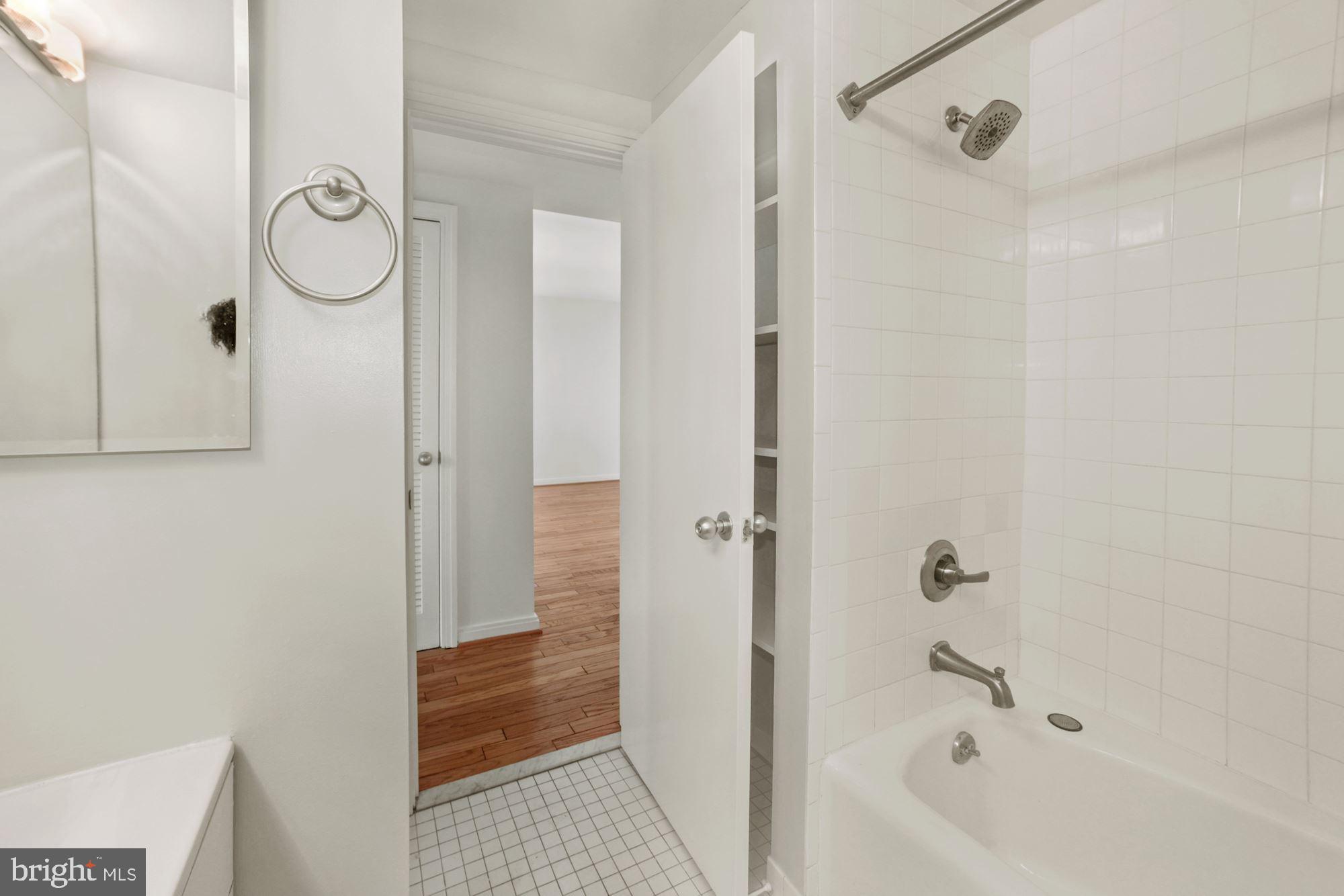 649 C Street Southeast, Unit 404 Washington, DC 20003 - Photo 9 of 10 Full bath with tub/shower and storage