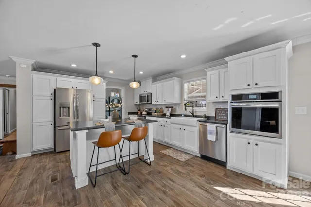 a bedroom with a bed couch and a window