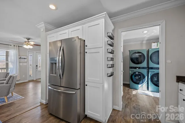a view of balcony with wooden floor and fence