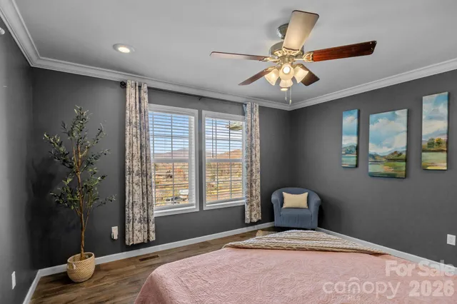 a bathroom with a sink a toilet a mirror and shower