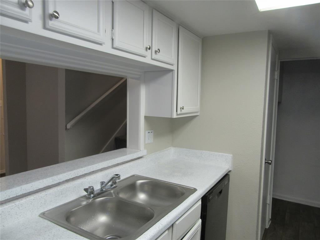 11311 Audelia Road, Unit 241 Dallas, TX 75243 - Photo 4 of 11 a kitchen with a sink and cabinets