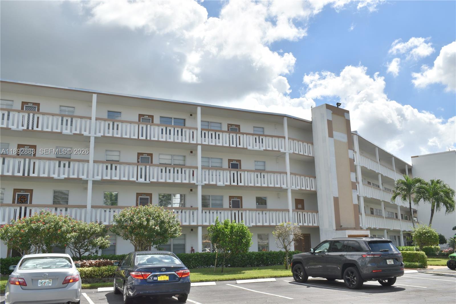 2011 Cornwall East, Unit A Boca Raton, FL 33434 - Photo 14 of 19 a car parked in front of a building