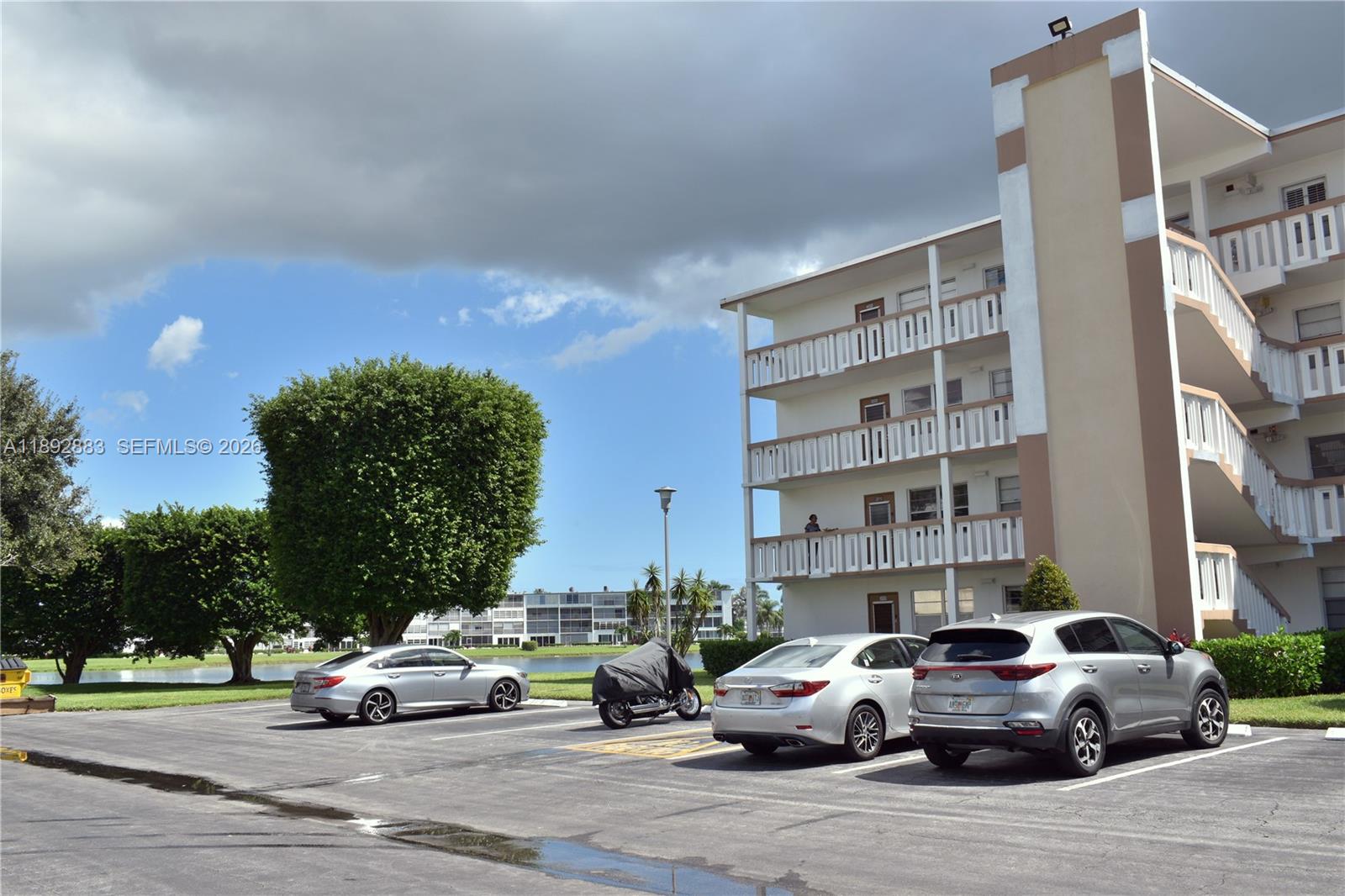 2011 Cornwall East, Unit A Boca Raton, FL 33434 - Photo 15 of 19 a cars parked in front of a building