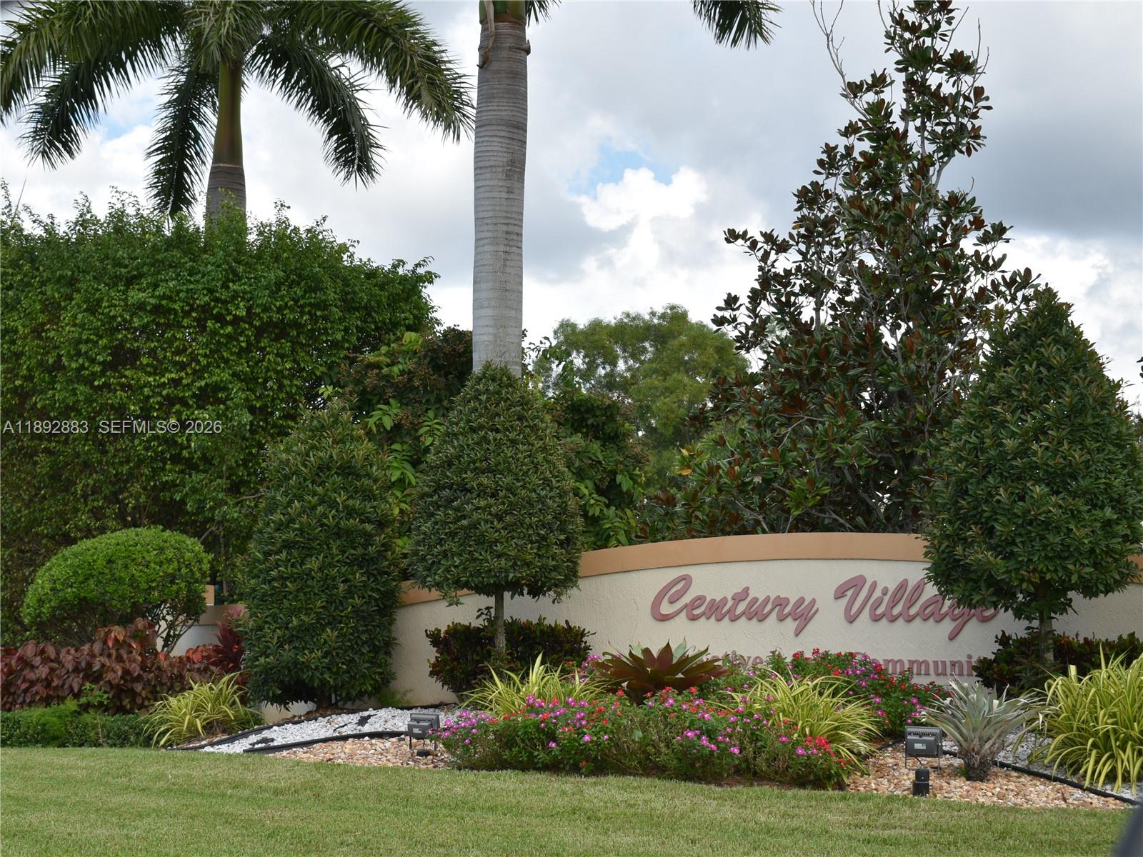2011 Cornwall East, Unit A Boca Raton, FL 33434 - Photo 17 of 19 a sign that is sitting on a brick wall