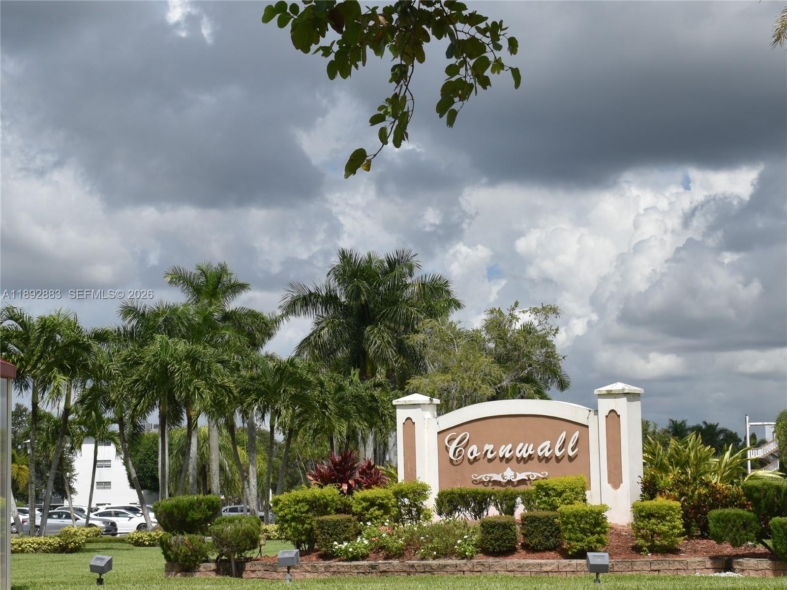 2011 Cornwall East, Unit A Boca Raton, FL 33434 - Photo 19 of 19 a sign board with a house in the background