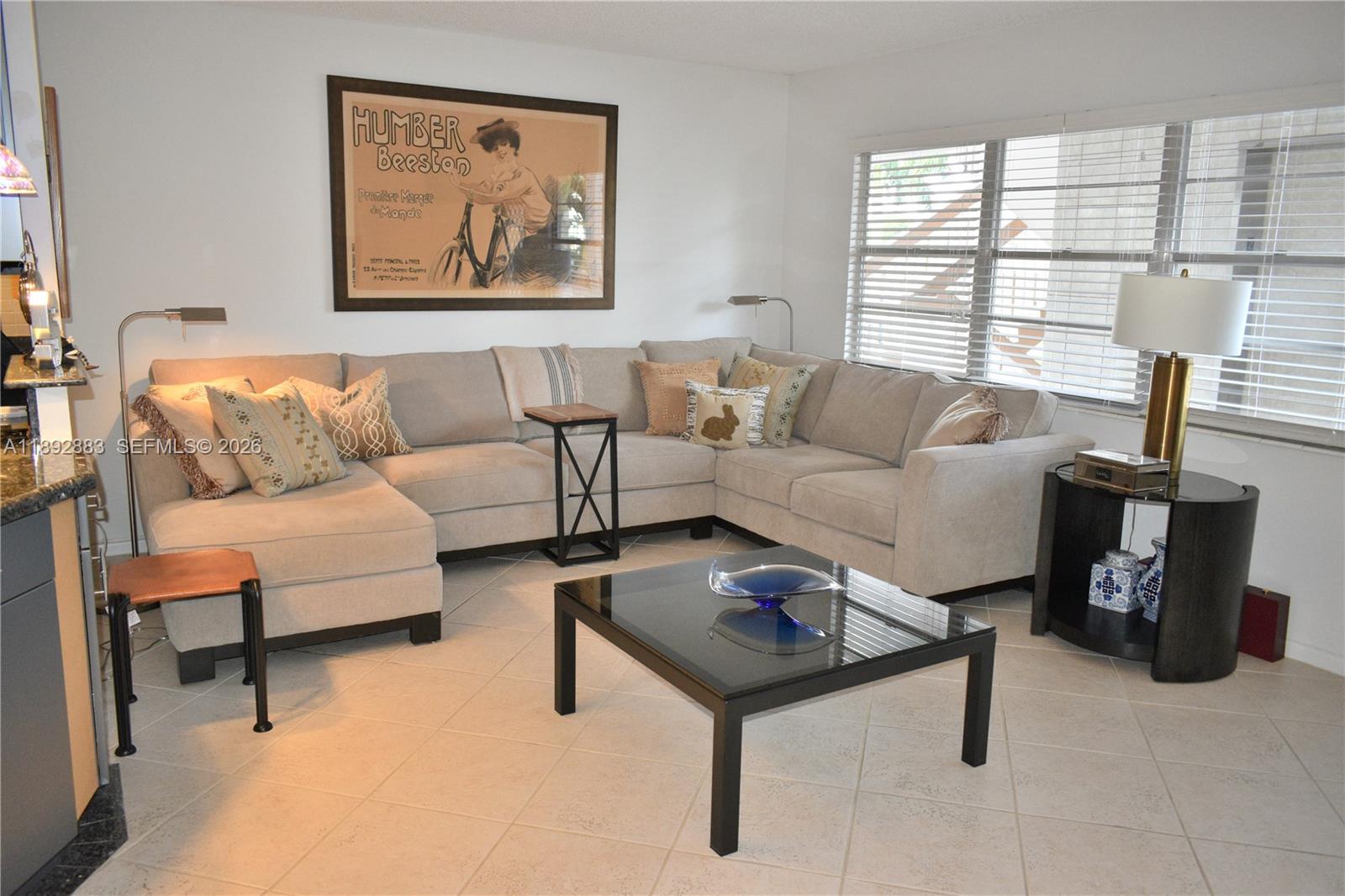 2011 Cornwall East, Unit A Boca Raton, FL 33434 - Photo 5 of 19 a living room with furniture and a window