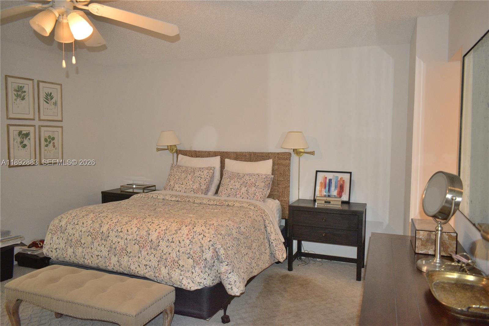 2011 Cornwall East, Unit A Boca Raton, FL 33434 - Photo 8 of 19 a bedroom with a bed and chandelier