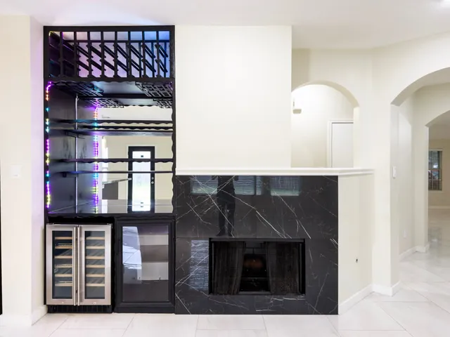 a black and white kitchen with cabinets