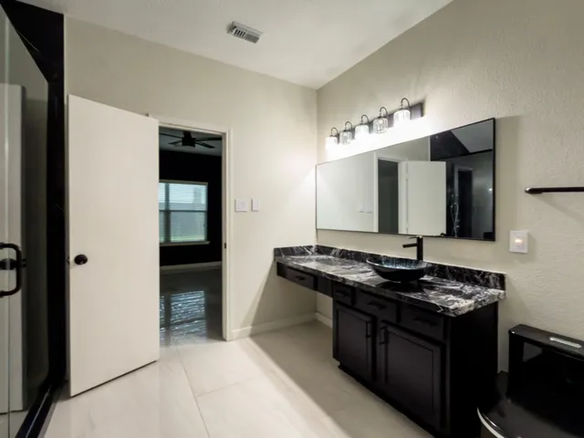 a kitchen with stainless steel appliances granite countertop a stove and a sink