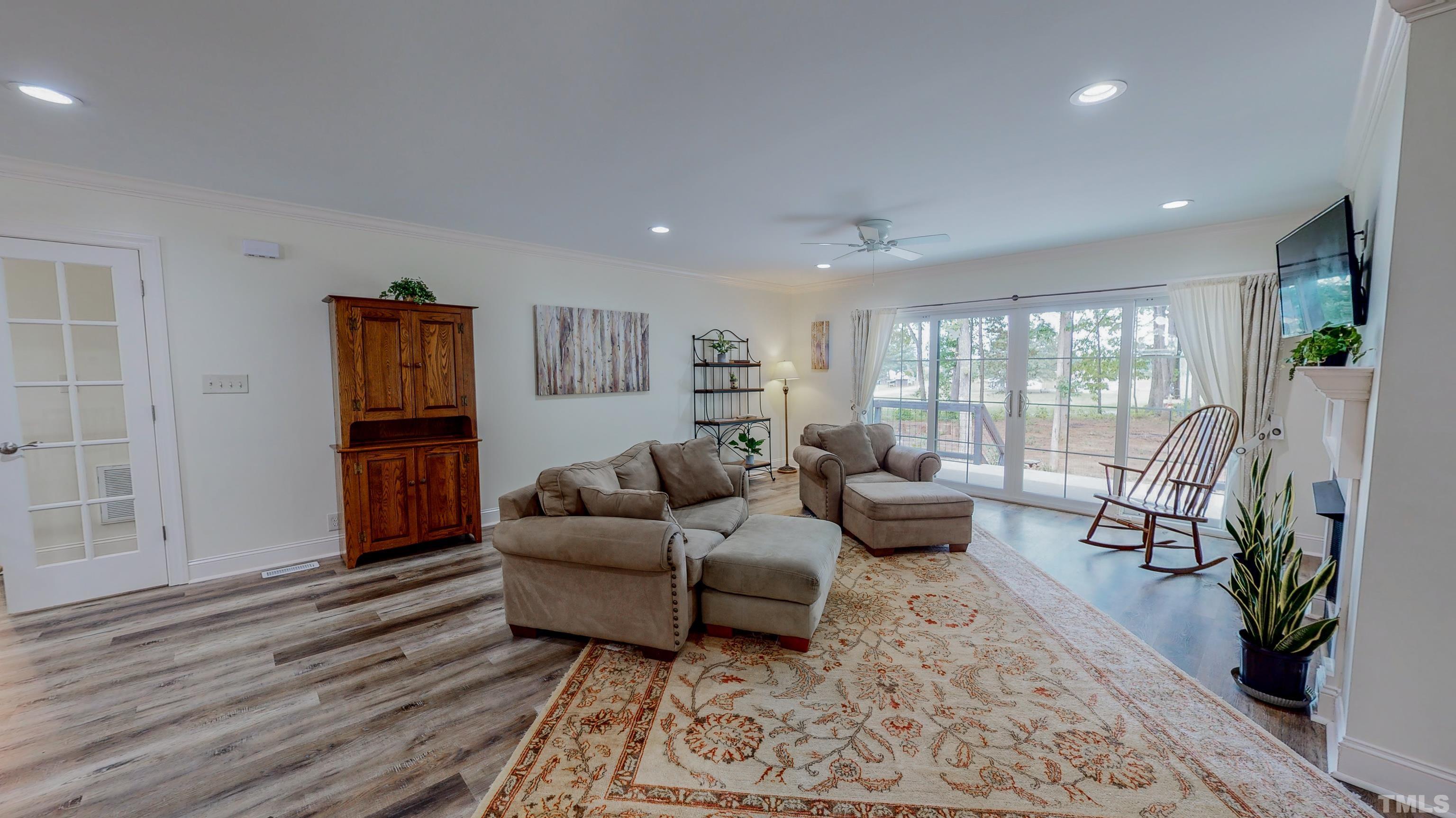 7402 Deer Crossing Road Rougemont, NC 27572 - Photo 12 of 54 a living room with furniture and a wooden floor