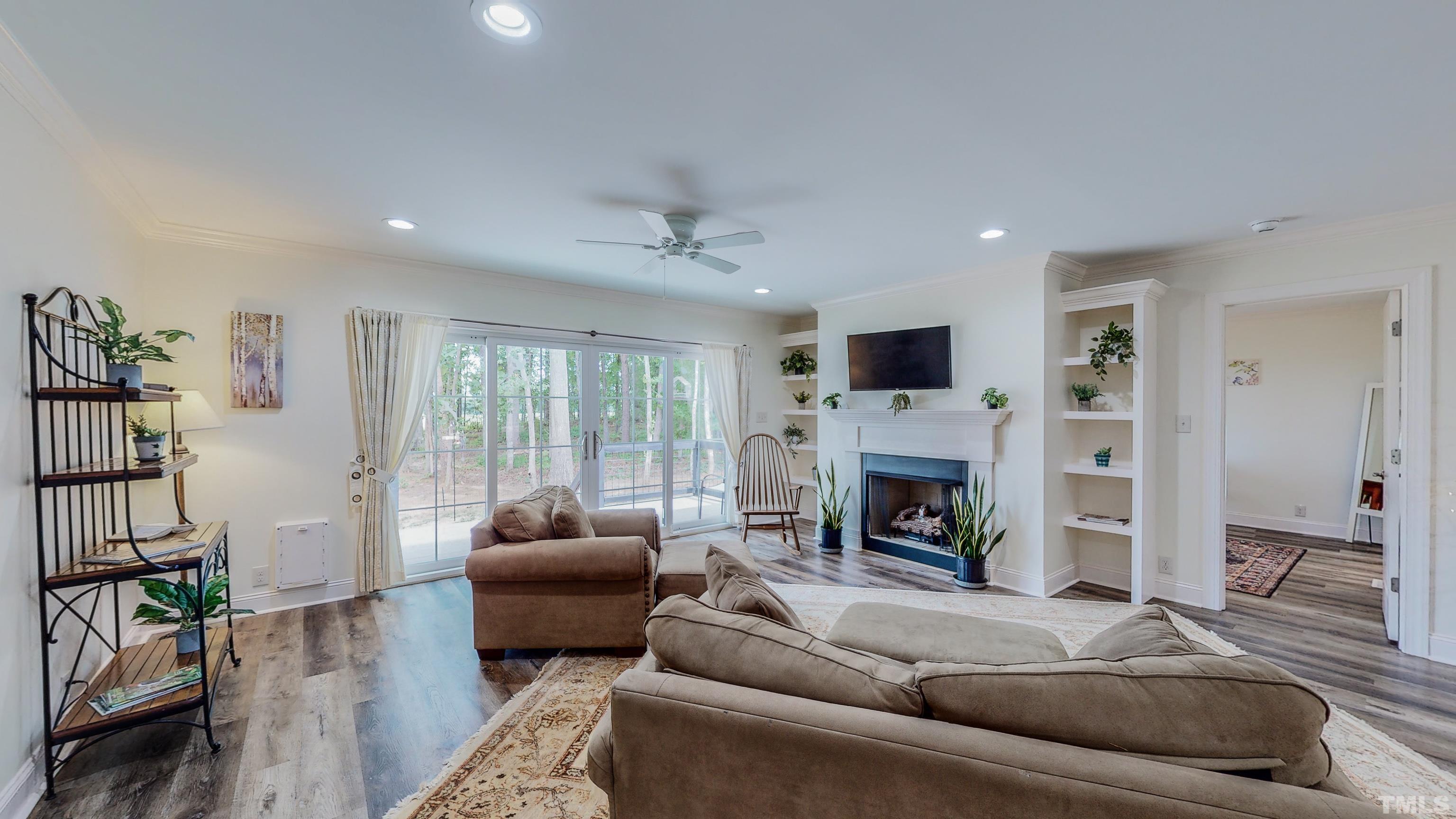 7402 Deer Crossing Road Rougemont, NC 27572 - Photo 13 of 54 a living room with furniture and a fireplace