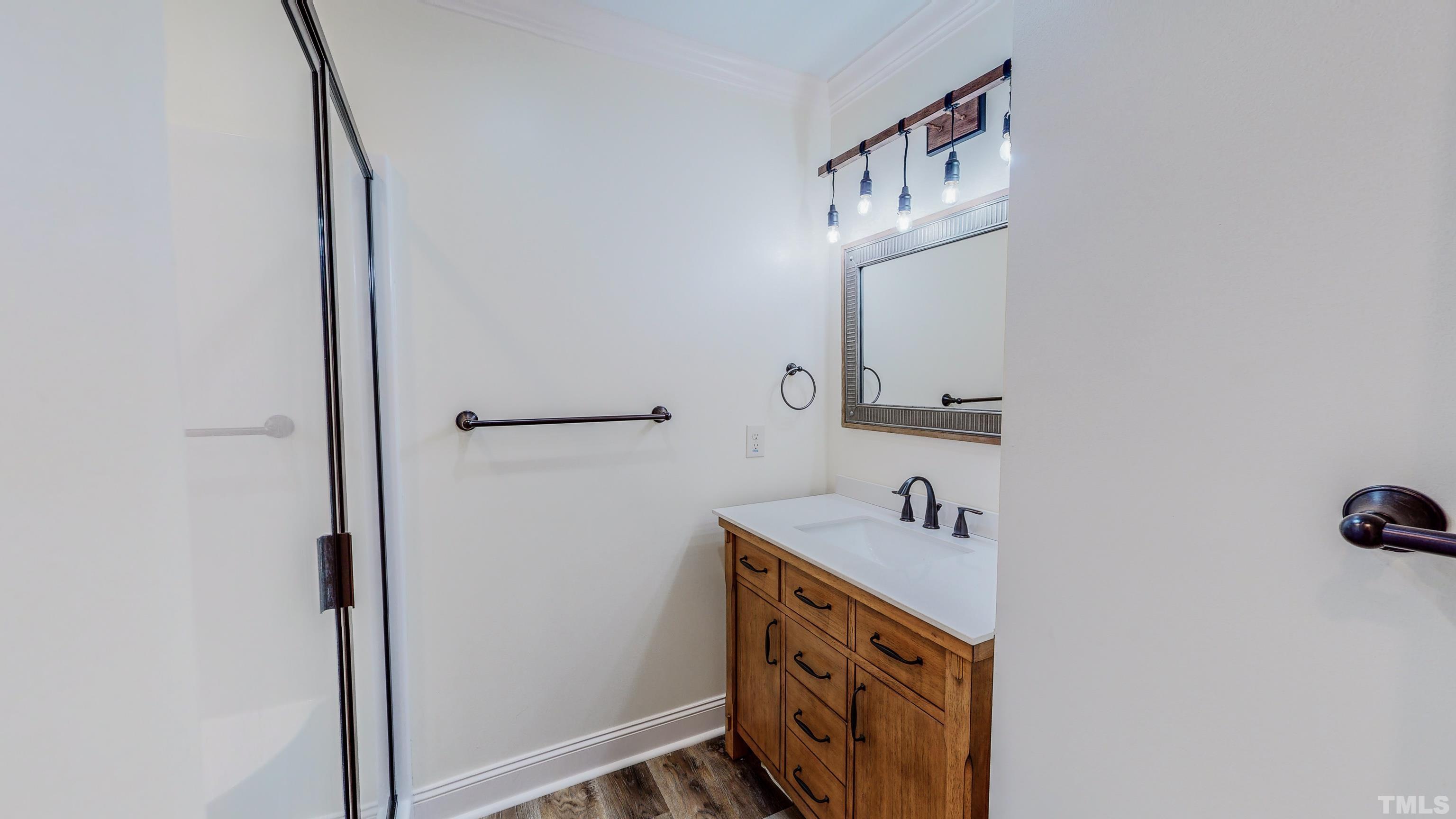 7402 Deer Crossing Road Rougemont, NC 27572 - Photo 17 of 54 a bathroom with a sink and a mirror