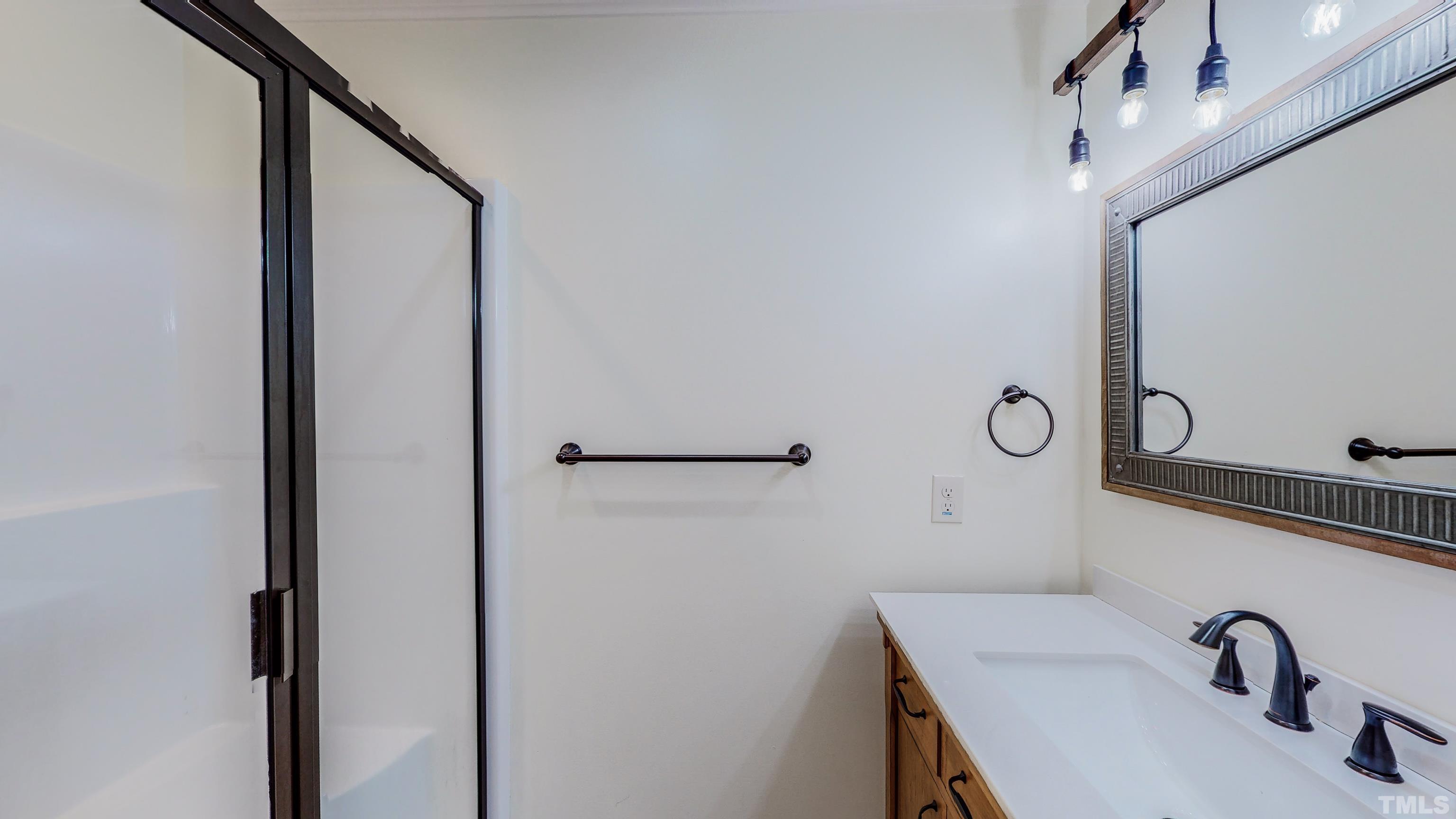 7402 Deer Crossing Road Rougemont, NC 27572 - Photo 18 of 54 a bathroom with a sink and mirror