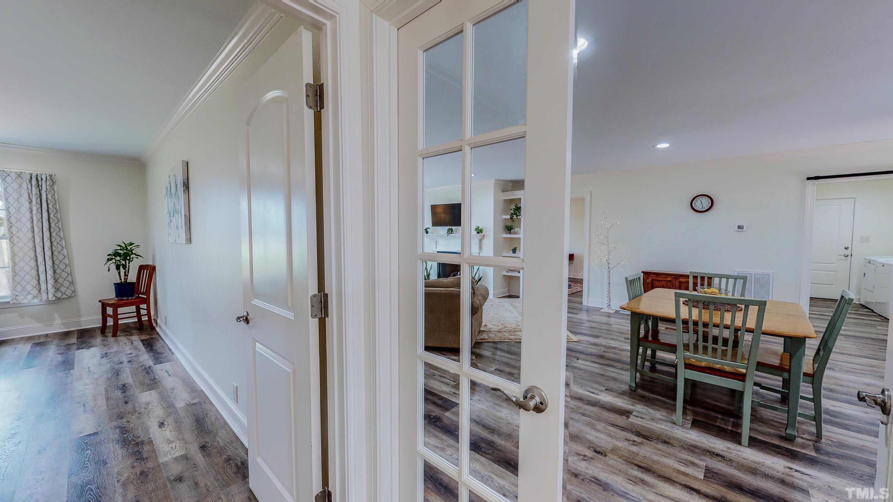 7402 Deer Crossing Road Rougemont, NC 27572 - Photo 22 of 54 a view of a room with furniture and wooden floor
