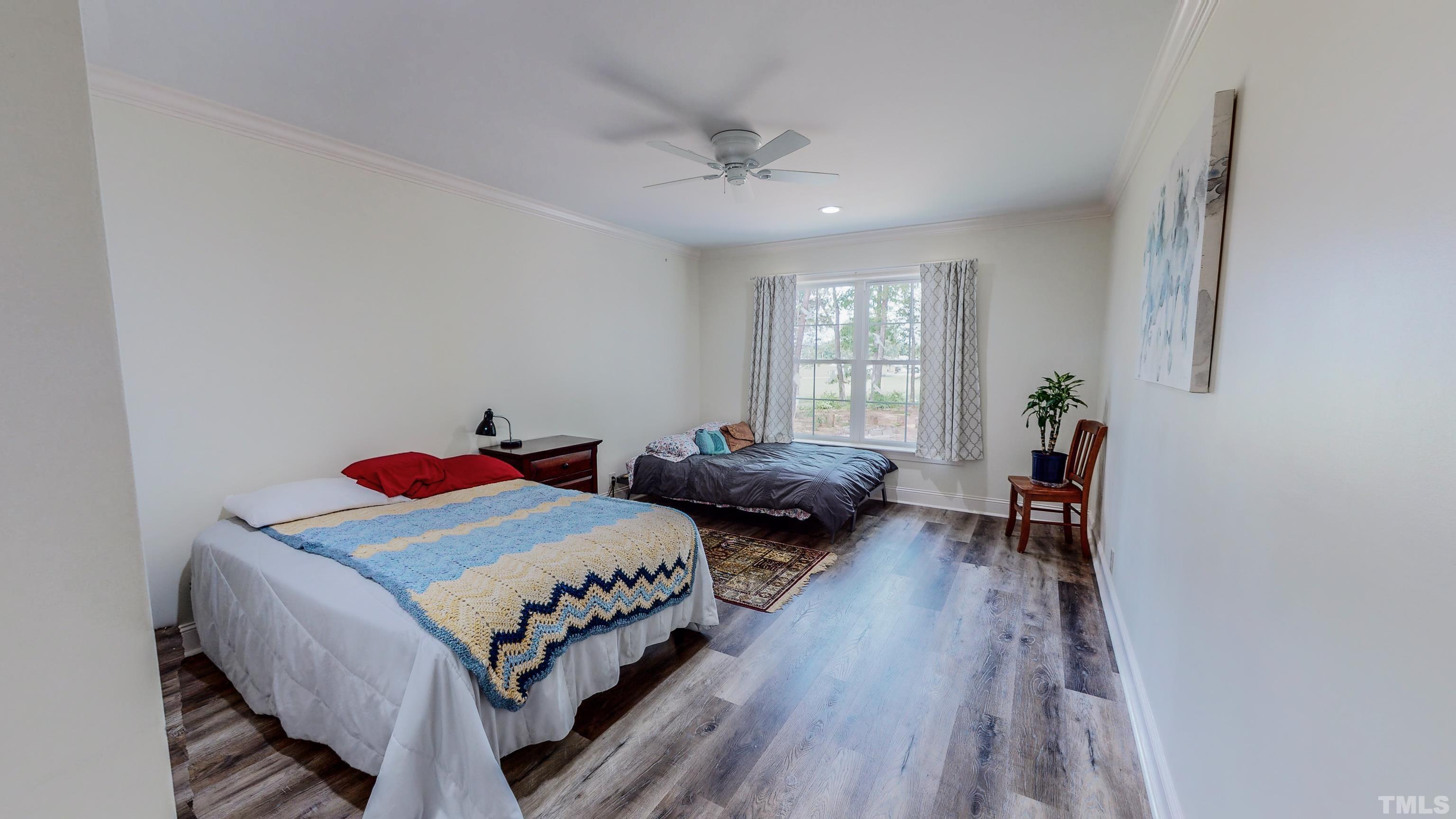 7402 Deer Crossing Road Rougemont, NC 27572 - Photo 24 of 54 a bedroom with a bed and a windows