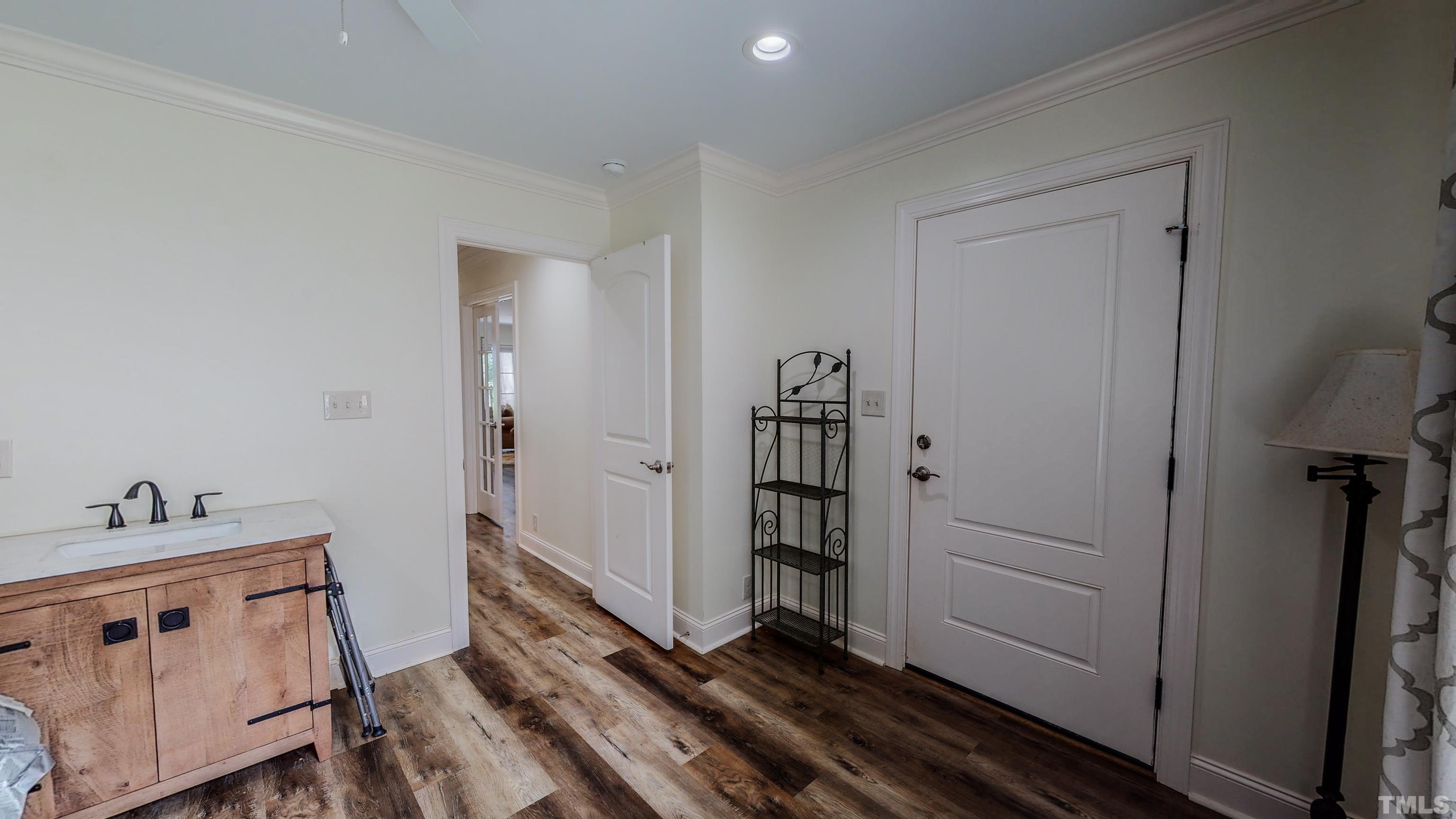 7402 Deer Crossing Road Rougemont, NC 27572 - Photo 28 of 54 a view of a hallway with closet and wooden floor