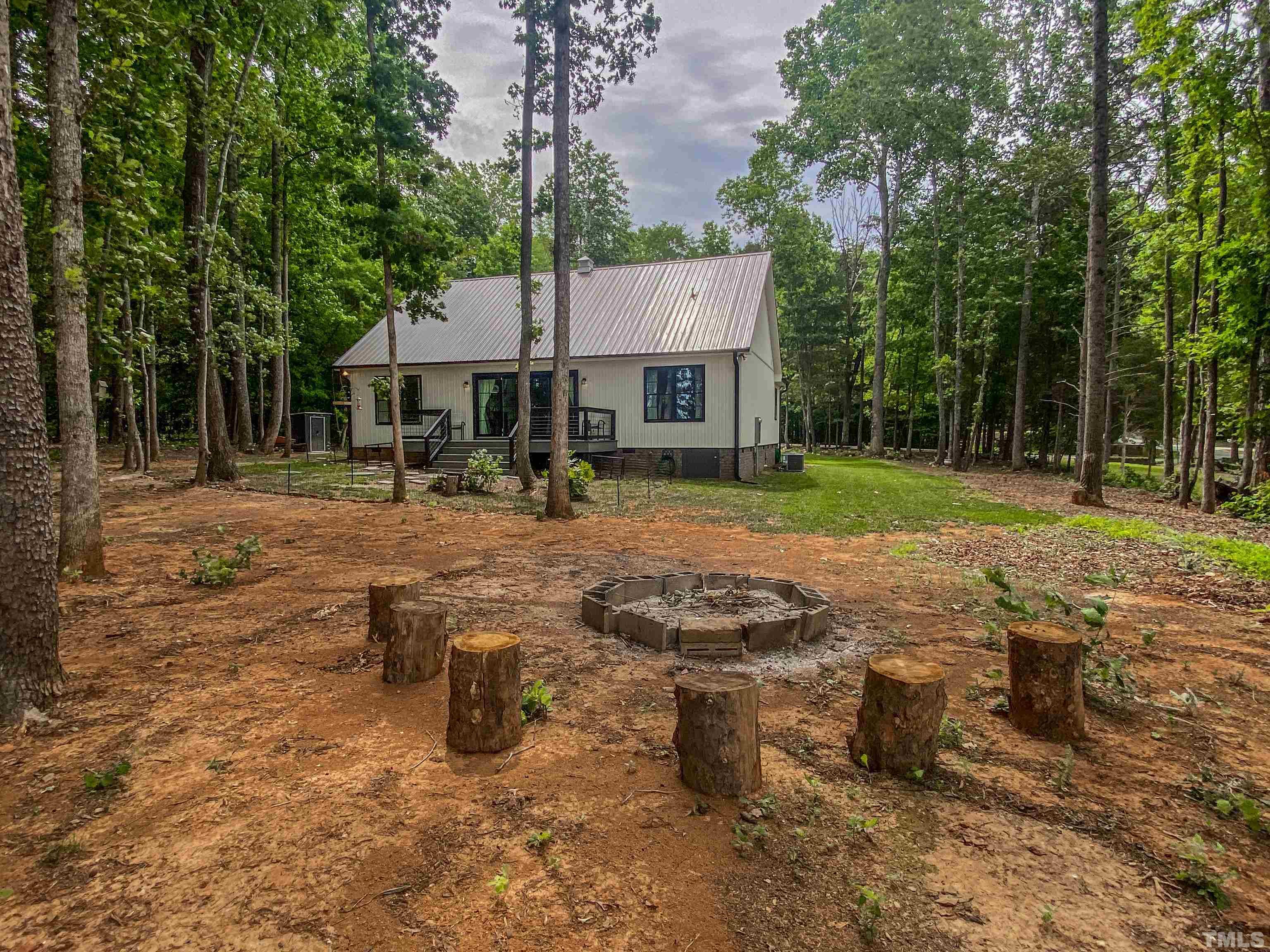 7402 Deer Crossing Road Rougemont, NC 27572 - Photo 30 of 54 a front view of a house with garden