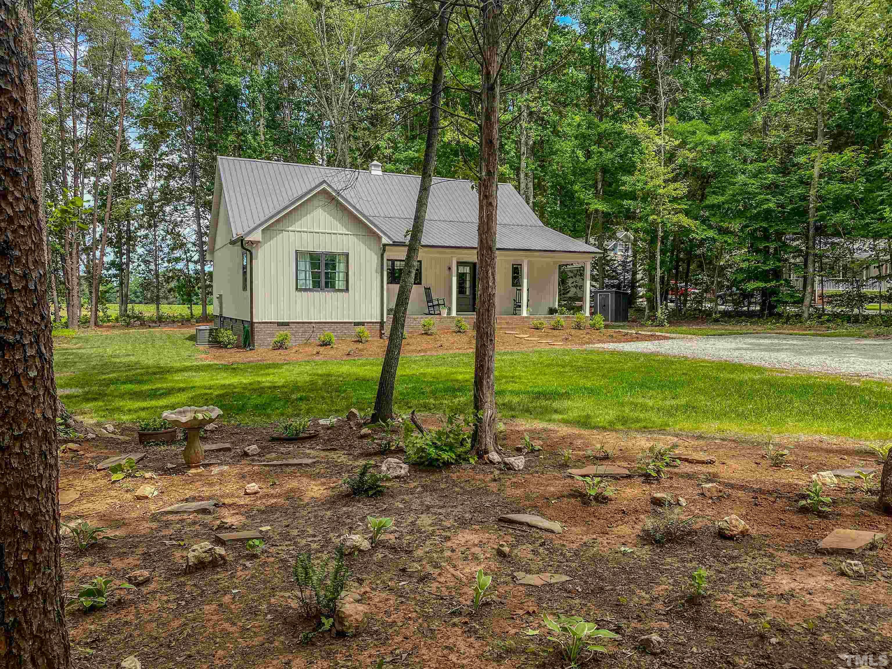 7402 Deer Crossing Road Rougemont, NC 27572 - Photo 31 of 54 a view of a house with a yard