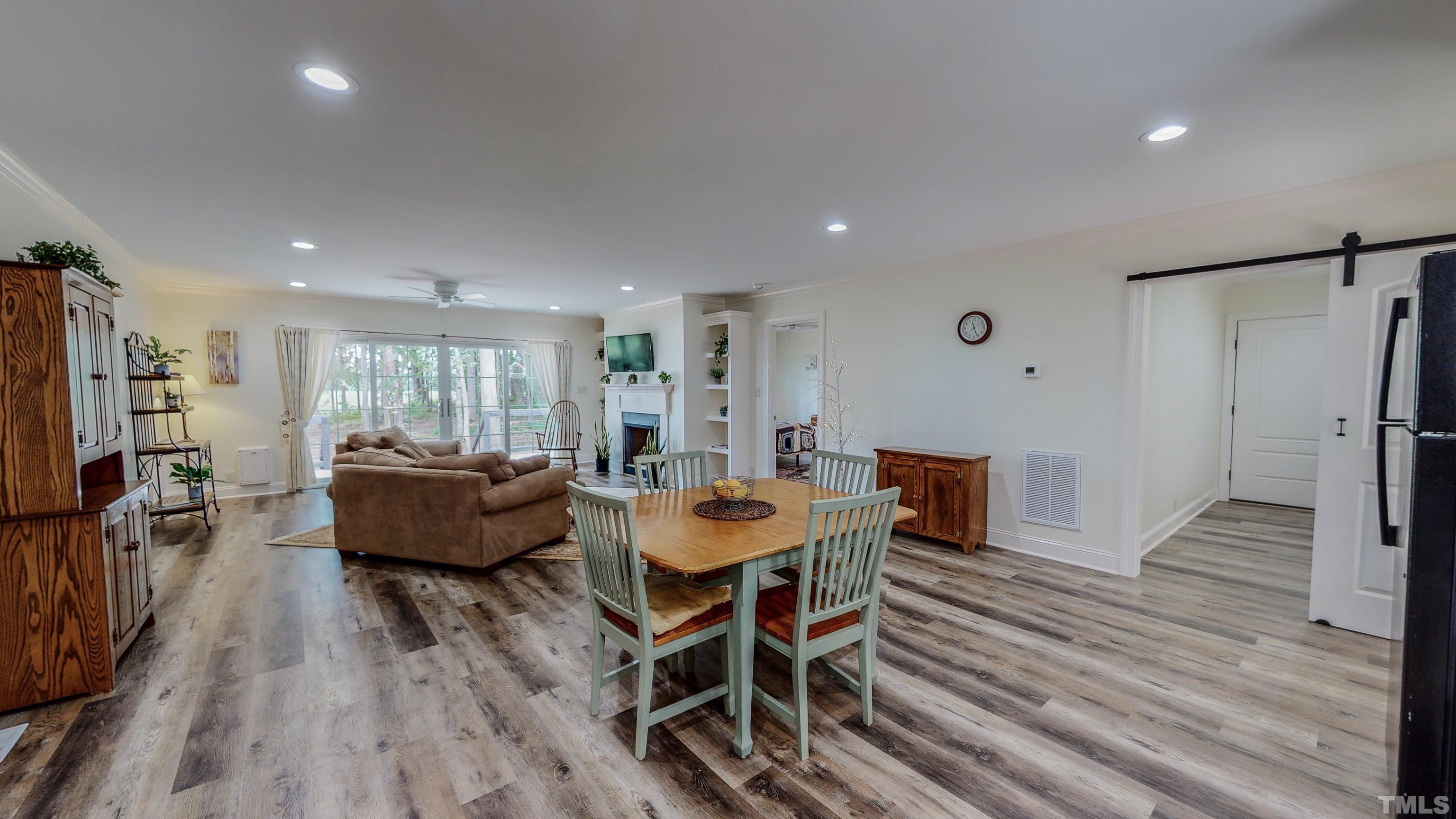 7402 Deer Crossing Road Rougemont, NC 27572 - Photo 32 of 54 a dining room with furniture and wooden floor