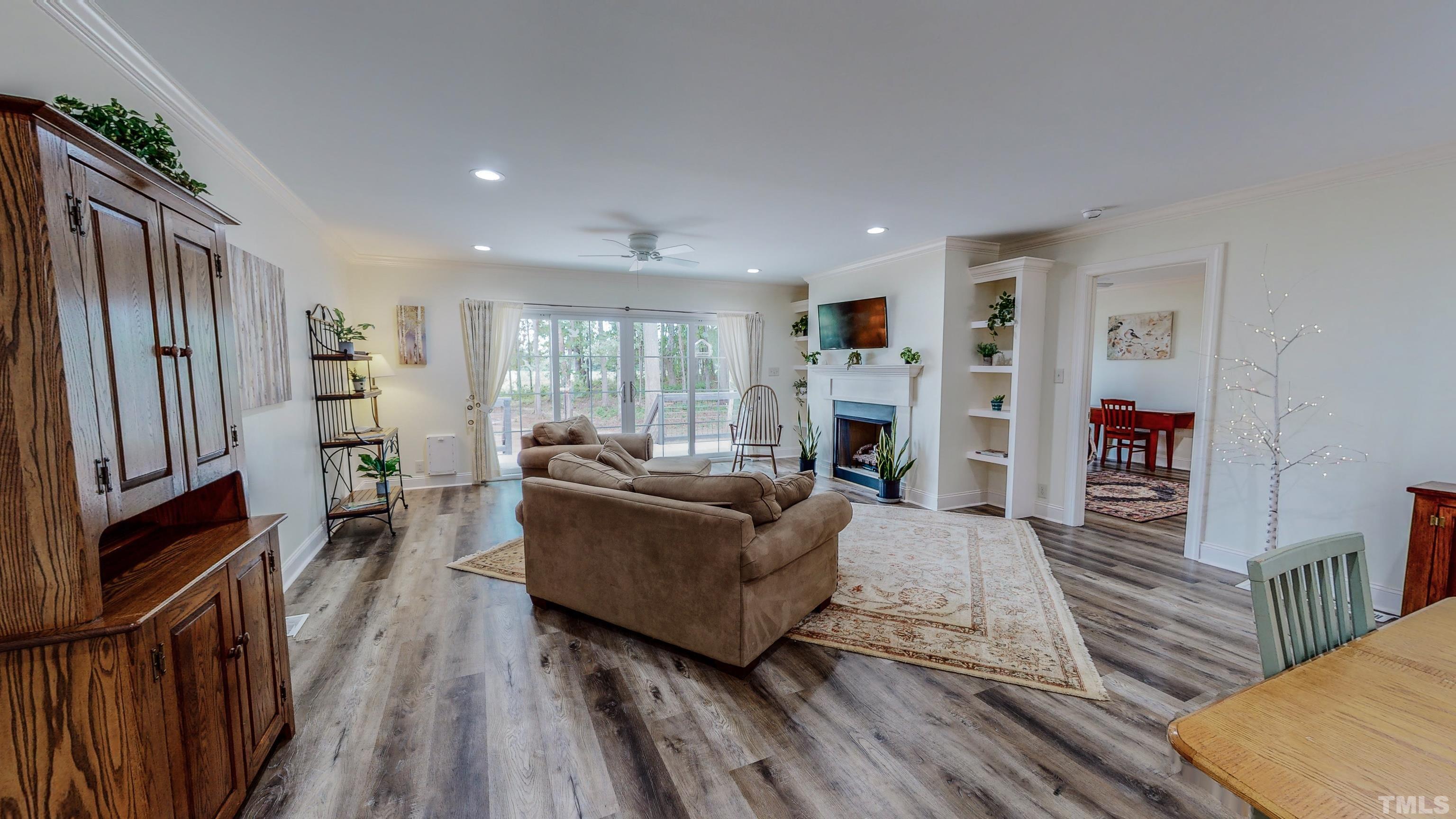 7402 Deer Crossing Road Rougemont, NC 27572 - Photo 37 of 54 a living room with furniture and a flat screen tv