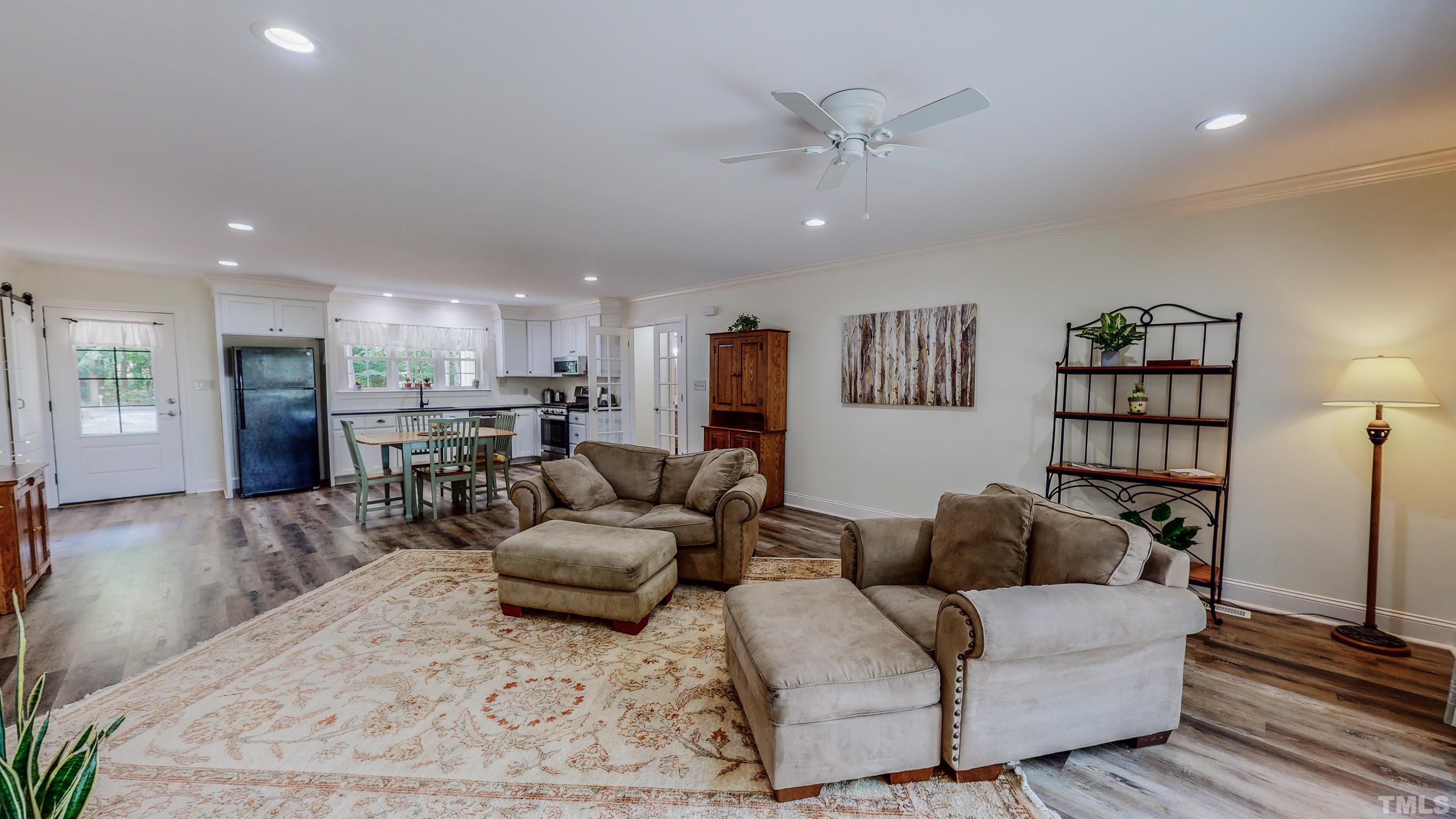 7402 Deer Crossing Road Rougemont, NC 27572 - Photo 41 of 54 a living room with furniture and a view of kitchen