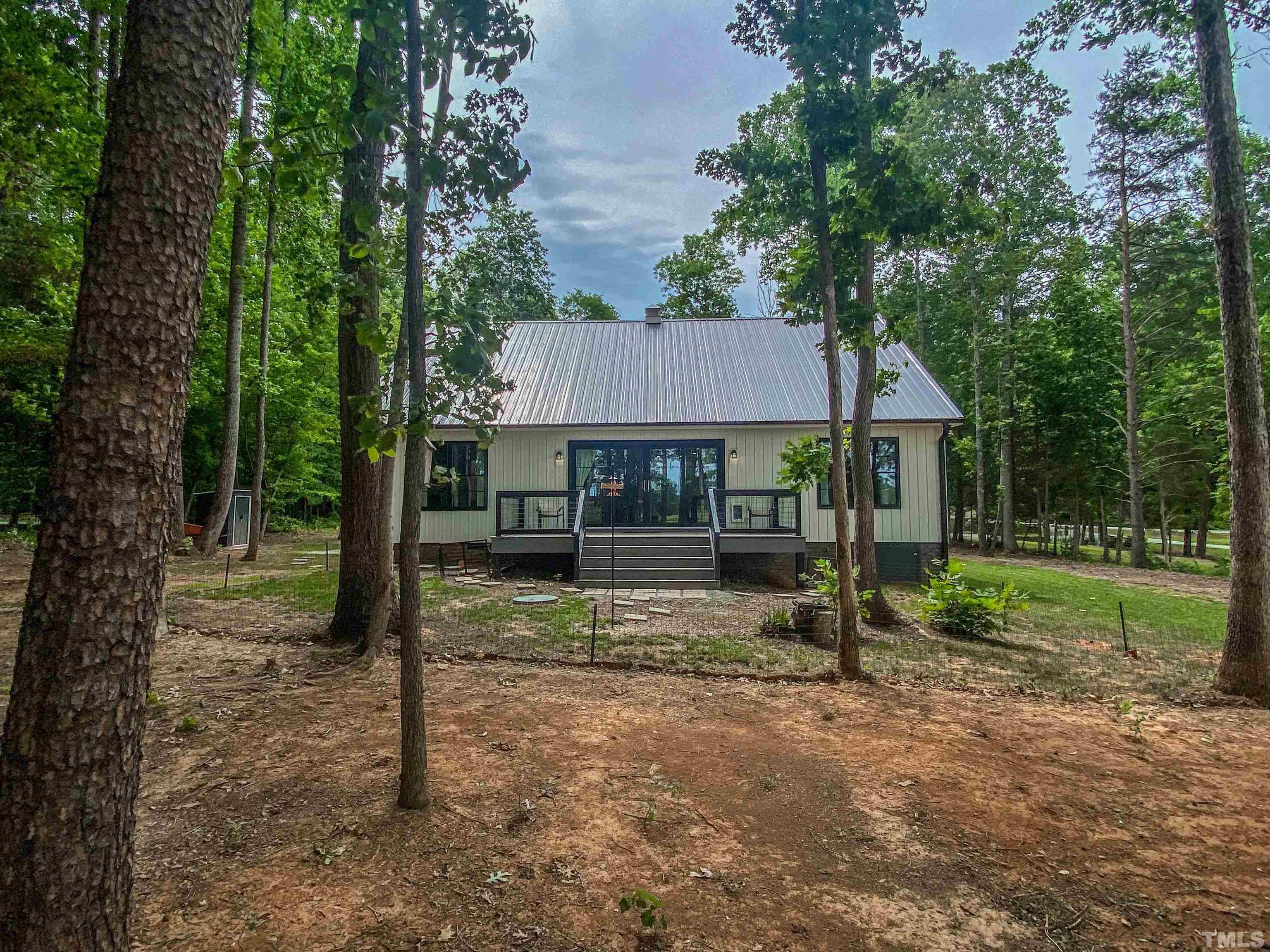 7402 Deer Crossing Road Rougemont, NC 27572 - Photo 45 of 54 a view of house with trees in the background