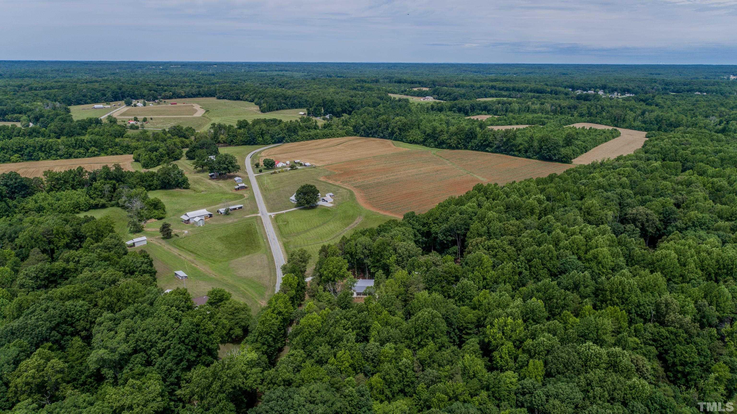 7402 Deer Crossing Road Rougemont, NC 27572 - Photo 46 of 54 an aerial view of a house with outdoor space and street view