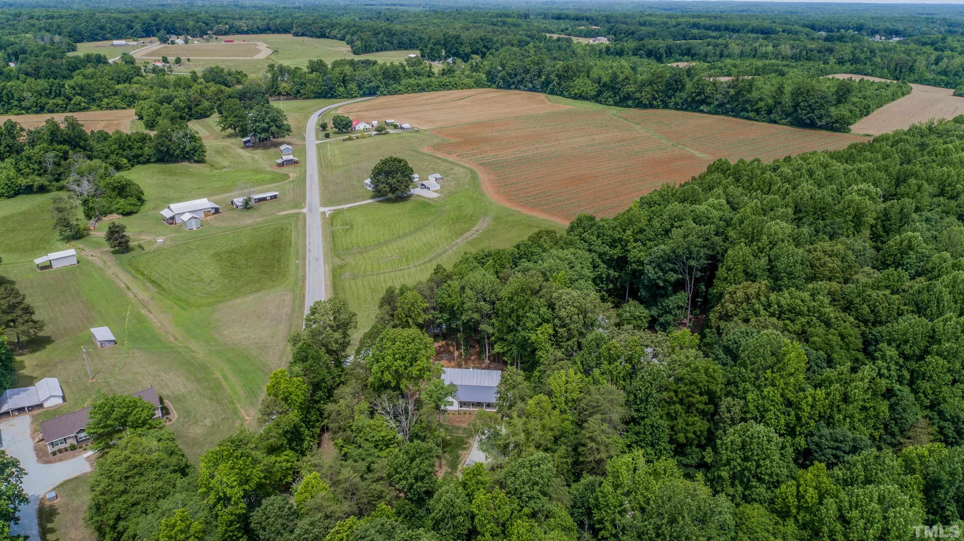 7402 Deer Crossing Road Rougemont, NC 27572 - Photo 47 of 54 an aerial view of a house with a yard and trees all around