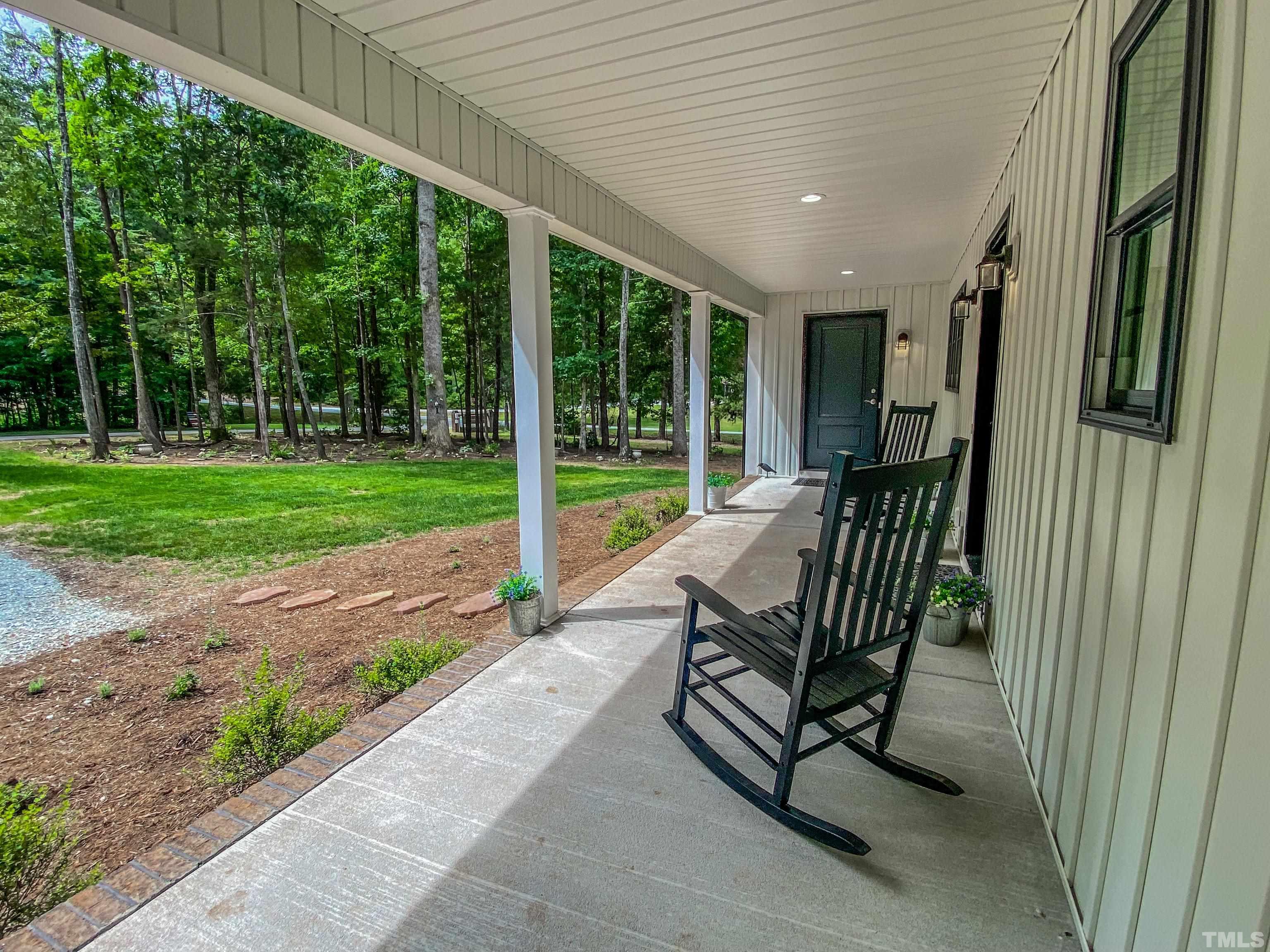 7402 Deer Crossing Road Rougemont, NC 27572 - Photo 49 of 54 a view of a two chair in the patio next to a yard