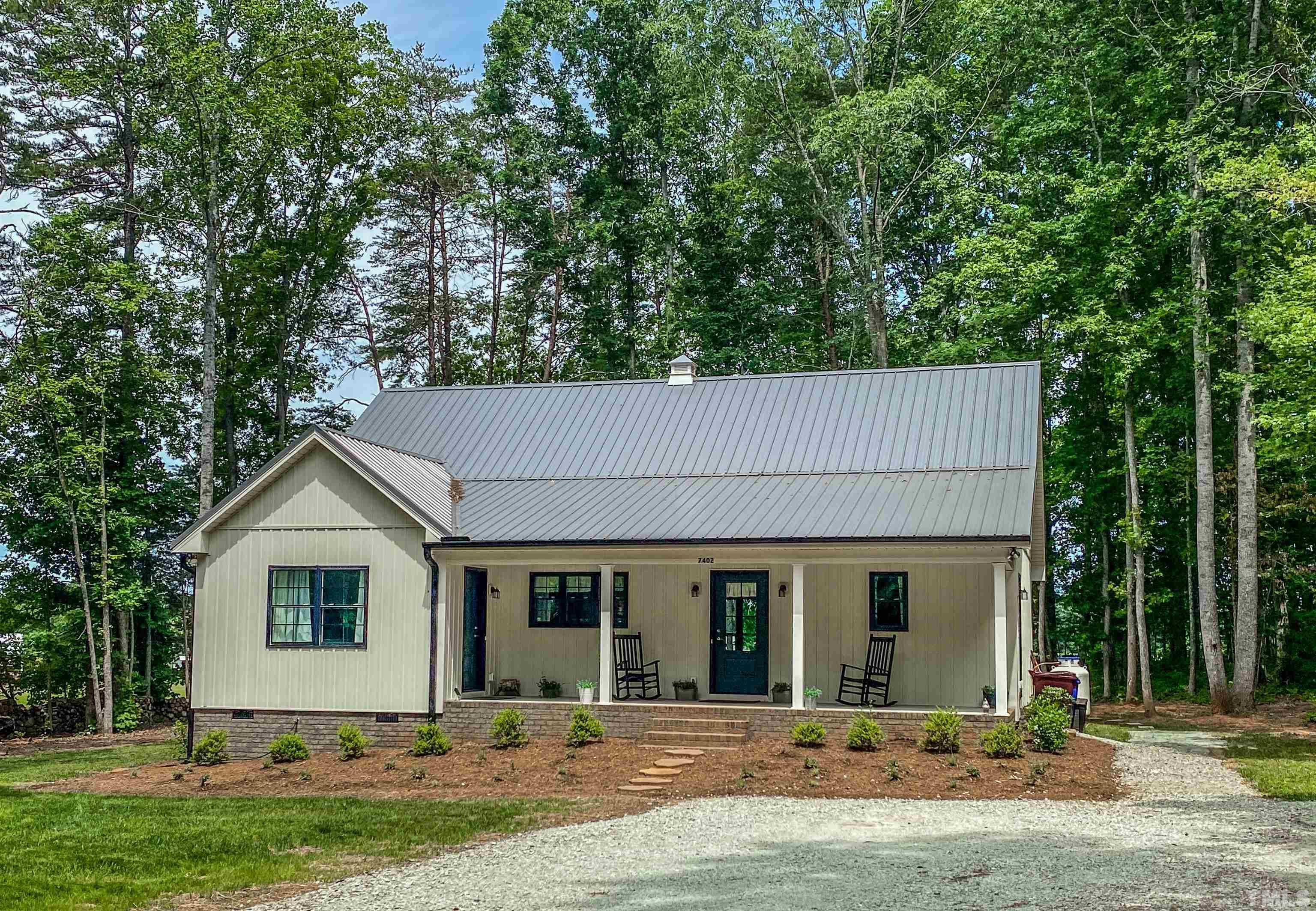 7402 Deer Crossing Road Rougemont, NC 27572 - Photo 53 of 54 a front view of house with yard and trees in the background