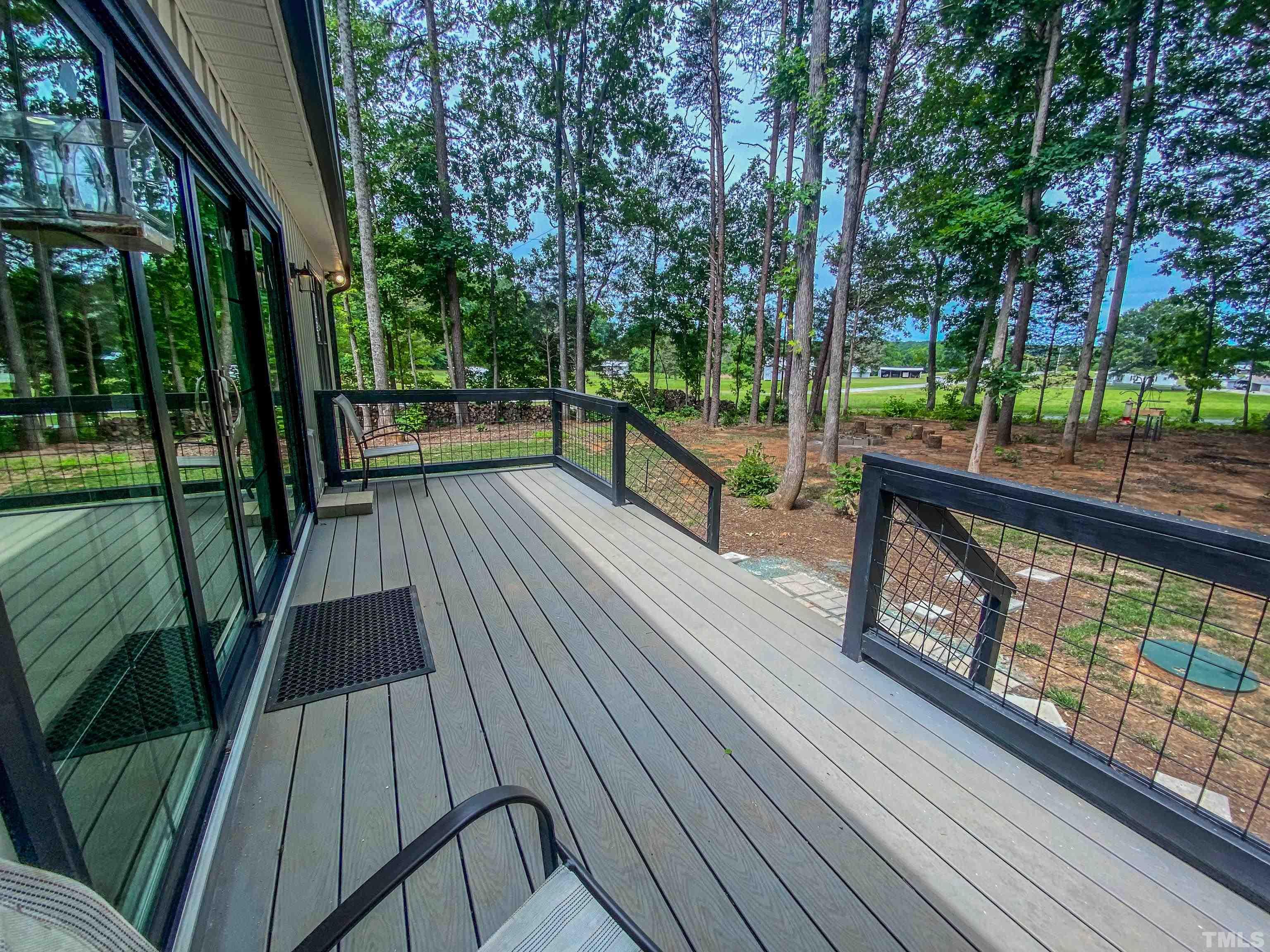 7402 Deer Crossing Road Rougemont, NC 27572 - Photo 7 of 54 a view of balcony with wooden floor and outdoor space