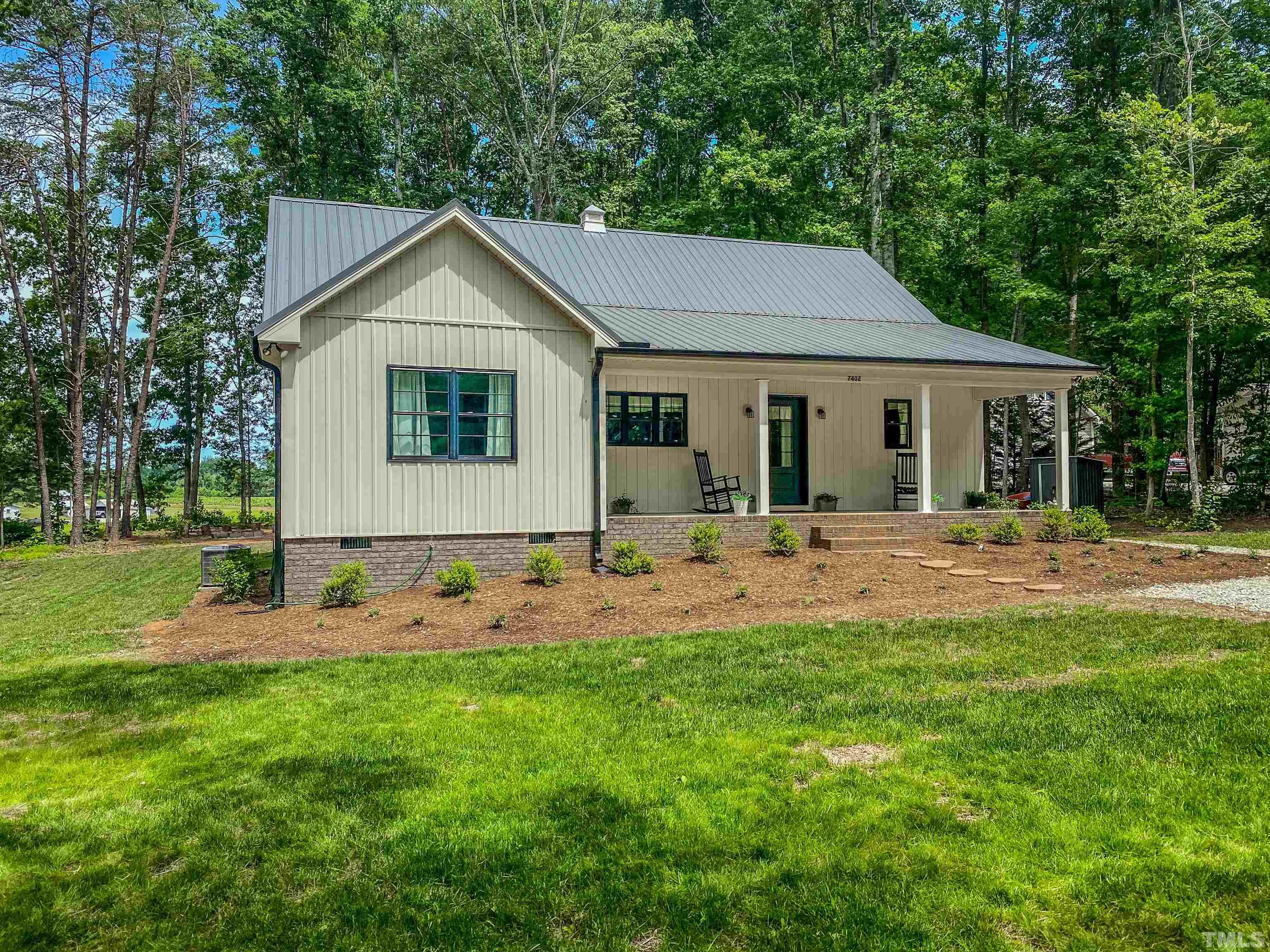 7402 Deer Crossing Road Rougemont, NC 27572 - Photo 9 of 54 a front view of house with yard and green space