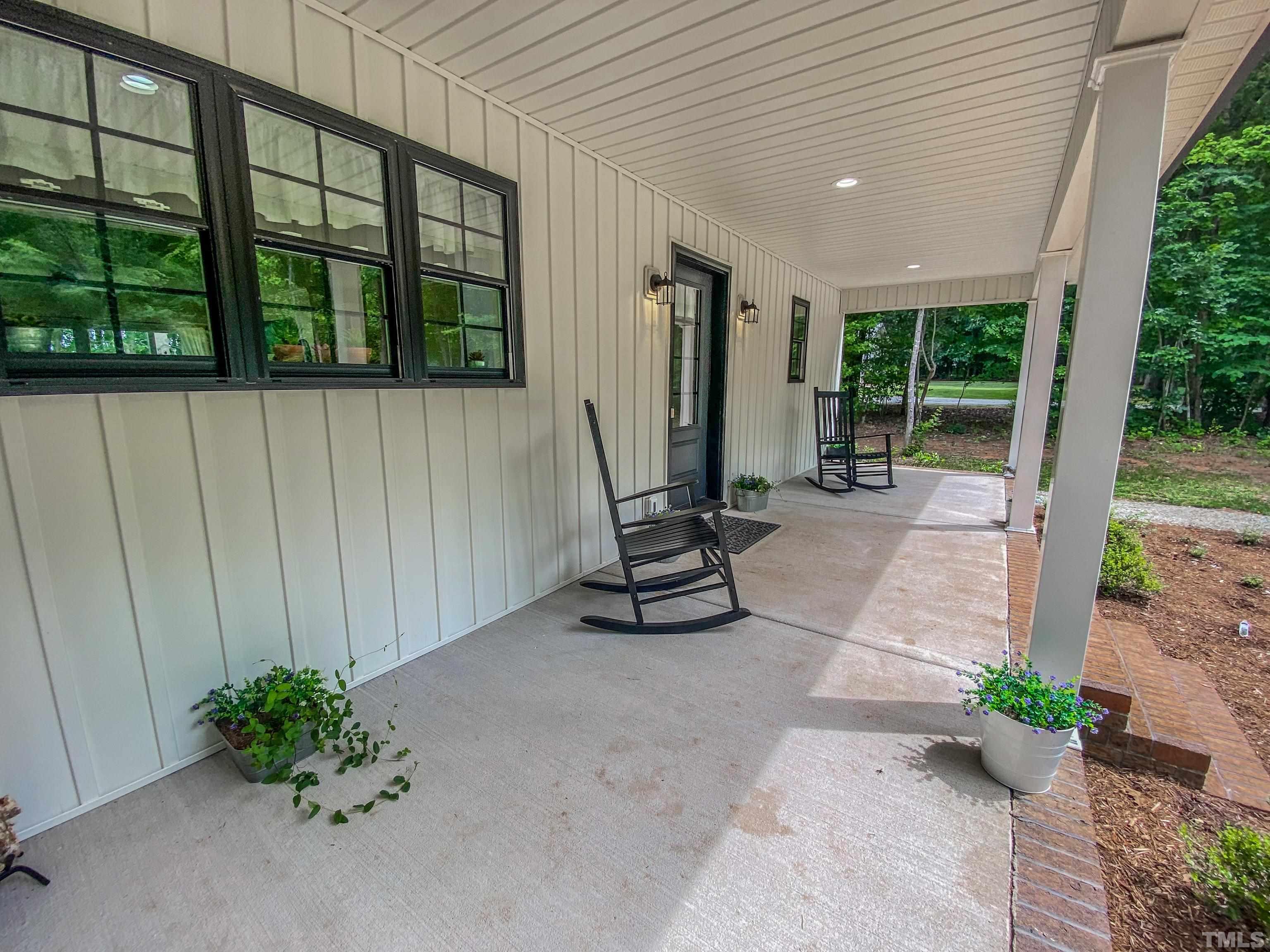 7402 Deer Crossing Road Rougemont, NC 27572 - Photo 10 of 54 a view of a patio with a table and chairs