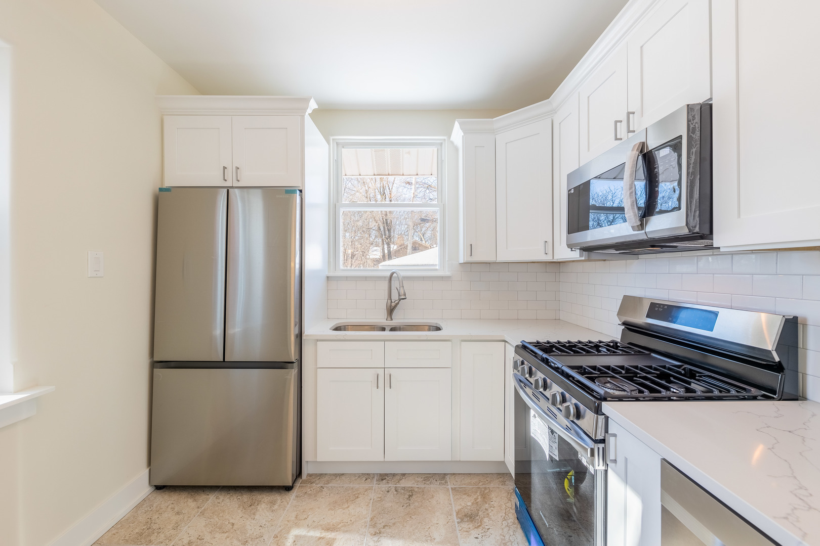 9160 South Hamilton Avenue Chicago, IL 60643 - Photo 12 of 53 a kitchen with stainless steel appliances granite countertop a refrigerator a sink a stove a microwave a counter space and cabinets
