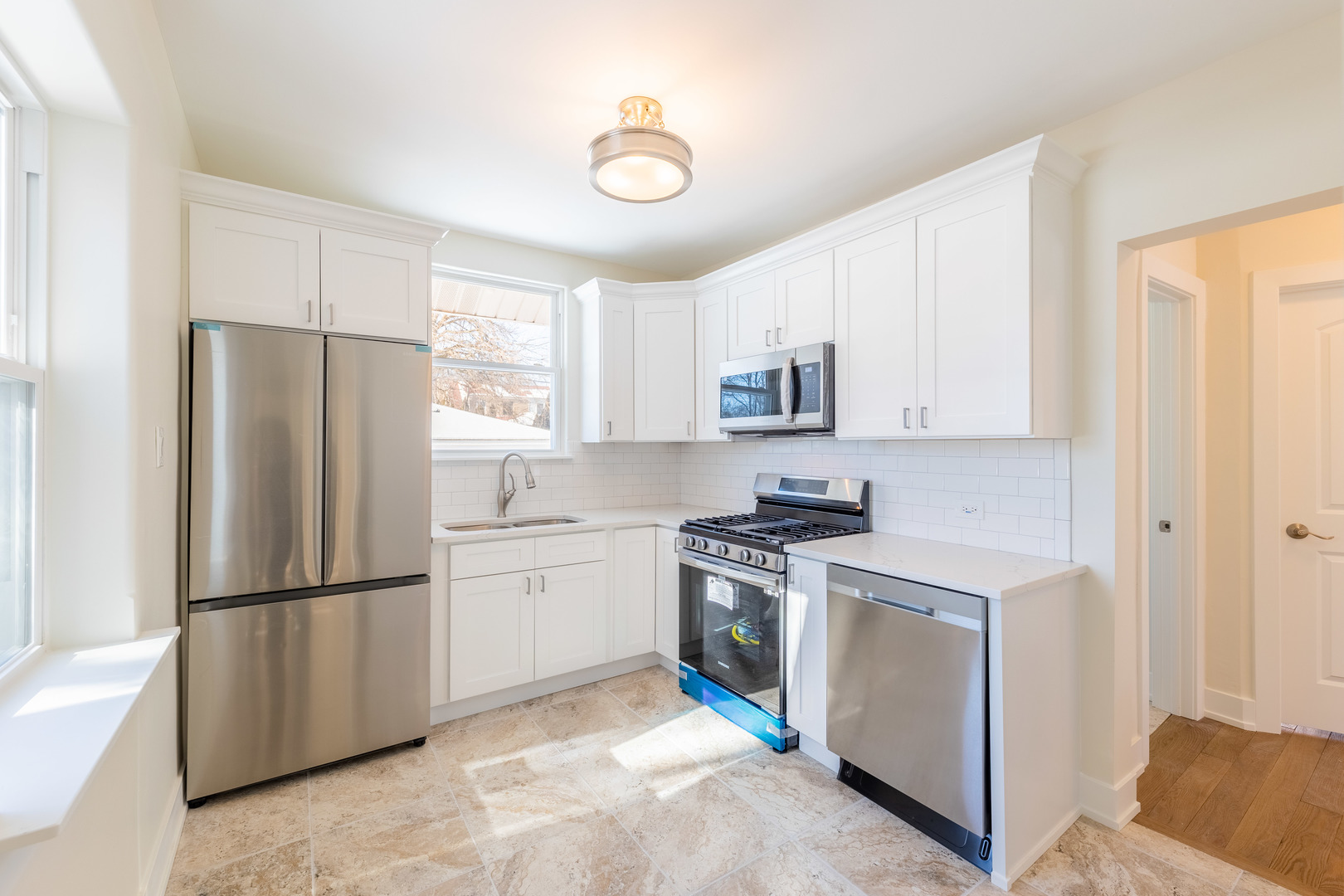 9160 South Hamilton Avenue Chicago, IL 60643 - Photo 13 of 53 a kitchen with white cabinets and stainless steel appliances