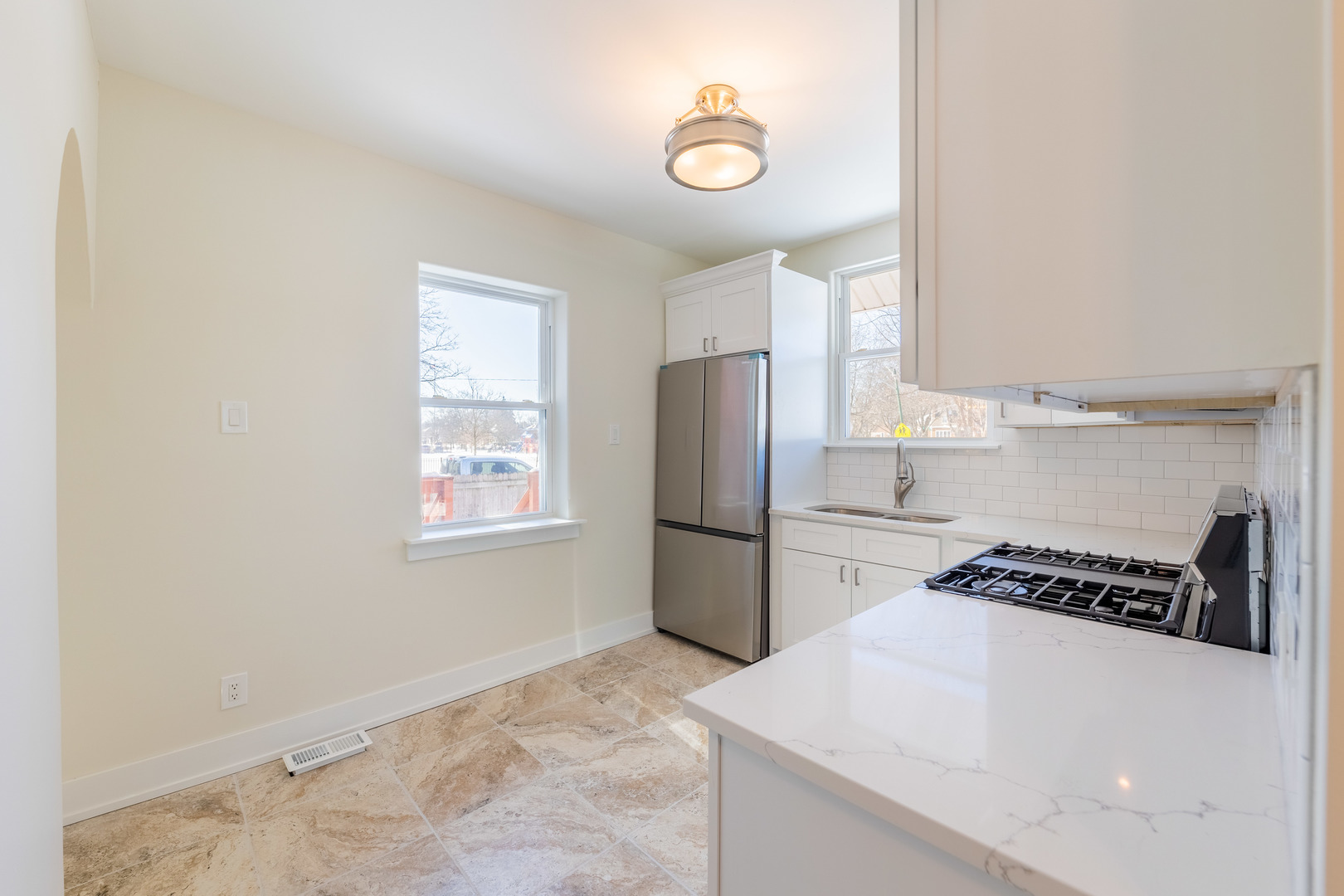 9160 South Hamilton Avenue Chicago, IL 60643 - Photo 14 of 53 a kitchen with a refrigerator a stove and a window