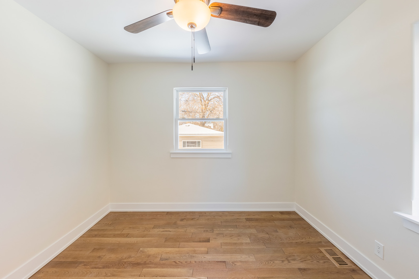 9160 South Hamilton Avenue Chicago, IL 60643 - Photo 16 of 53 an empty room with a window and a ceiling fan