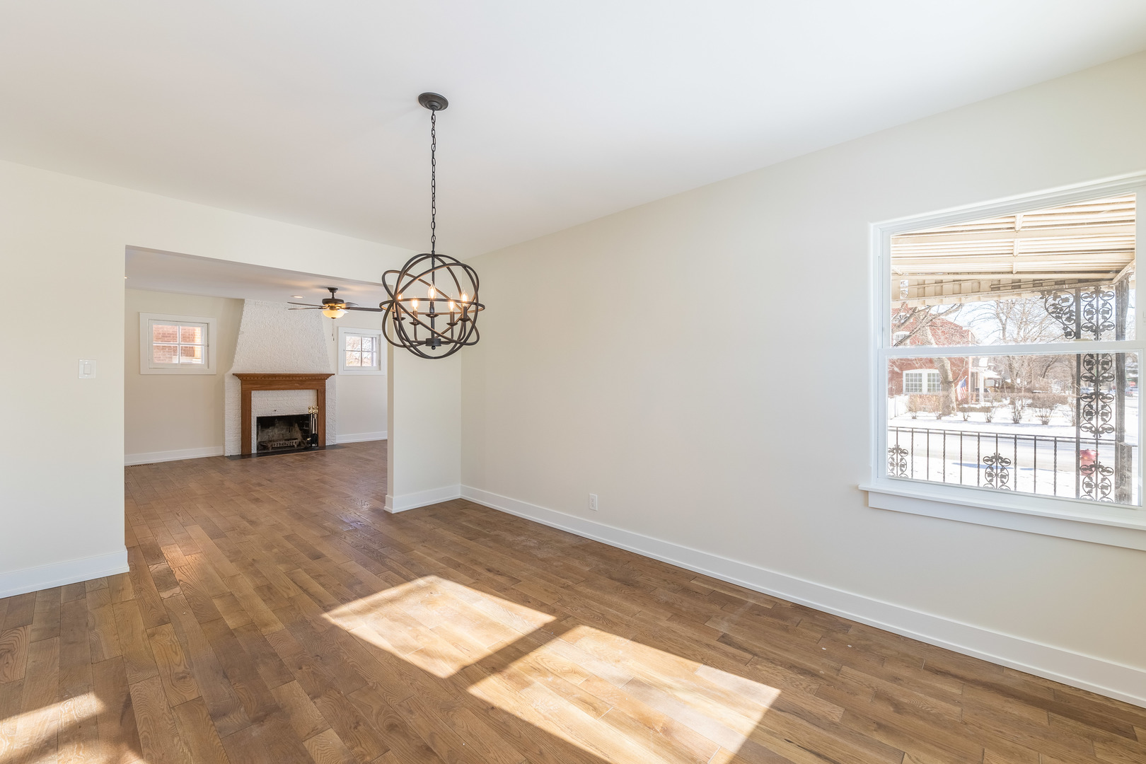 9160 South Hamilton Avenue Chicago, IL 60643 - Photo 19 of 53 a view of an empty room with a window and wooden floor