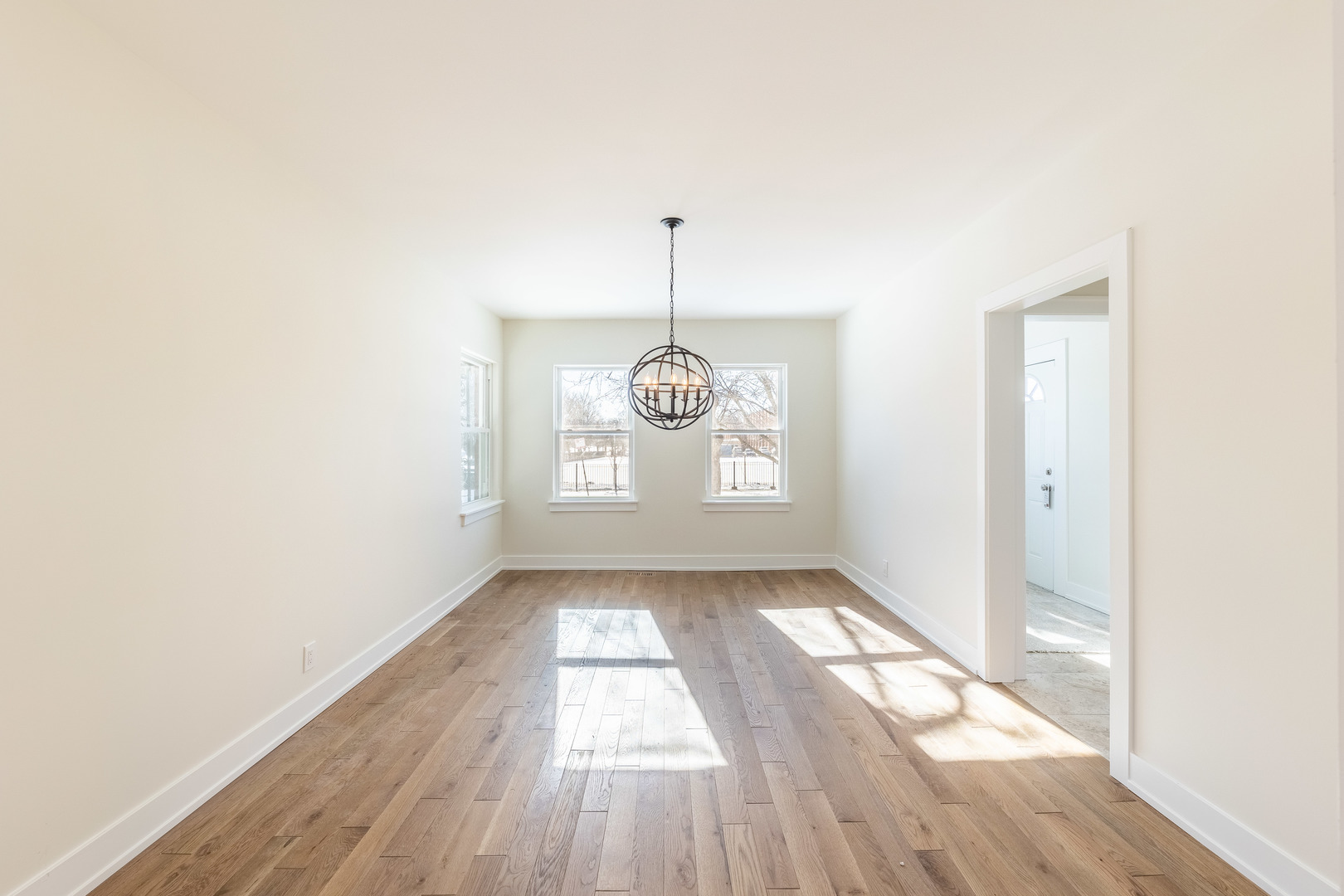 9160 South Hamilton Avenue Chicago, IL 60643 - Photo 20 of 53 an empty room with wooden floor and windows