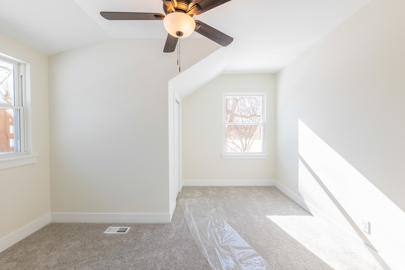 9160 South Hamilton Avenue Chicago, IL 60643 - Photo 22 of 53 an empty room with a window and a fan