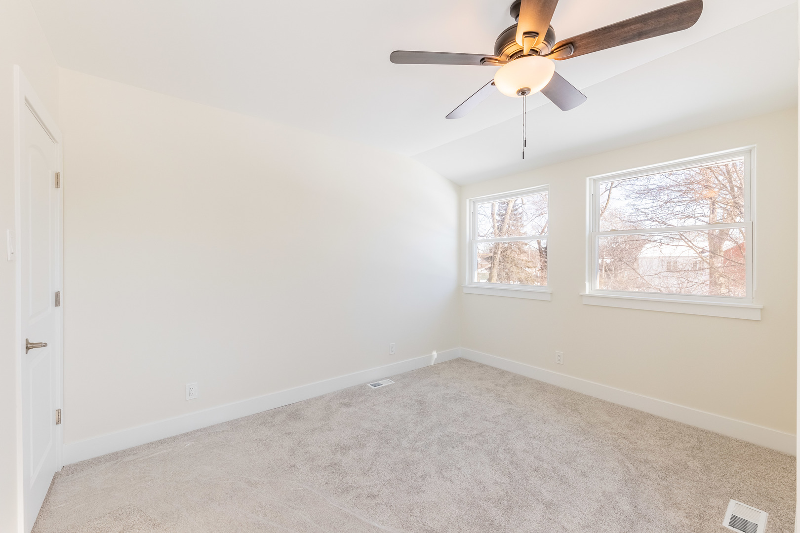 9160 South Hamilton Avenue Chicago, IL 60643 - Photo 23 of 53 an empty room with a window and a fan